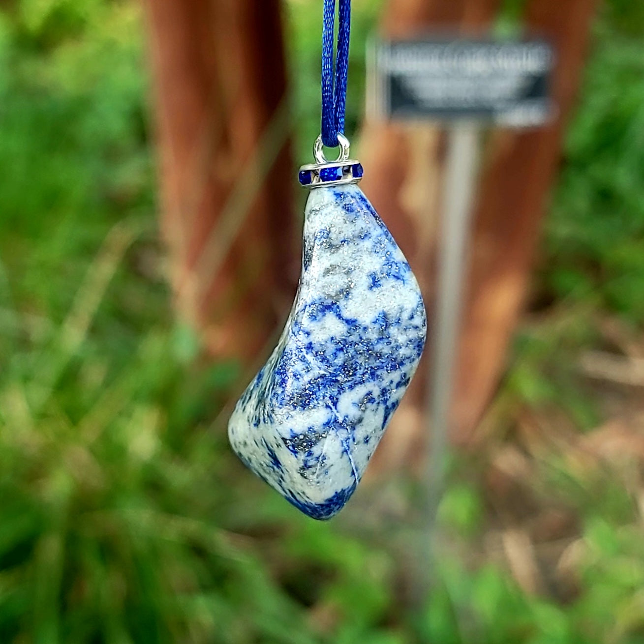 THIS MYSTIC LAPIS LAZULI PENDANT IS SURE TO EQUALLY INTRIGUE AND DELIGHT.