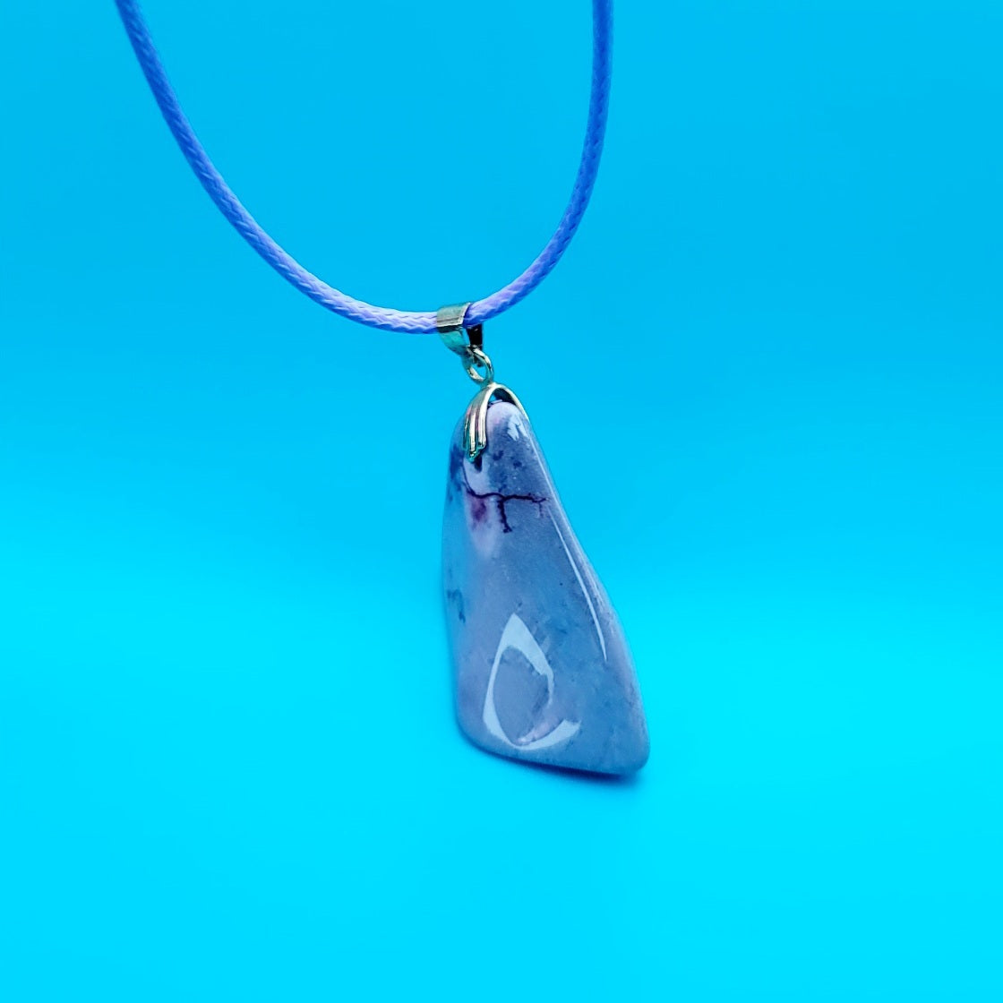 Experience the stunning natural beauty of our Desert Jasper Pendant. With its unique polychrome patterns and hues, this pendant is truly one-of-a-kind.