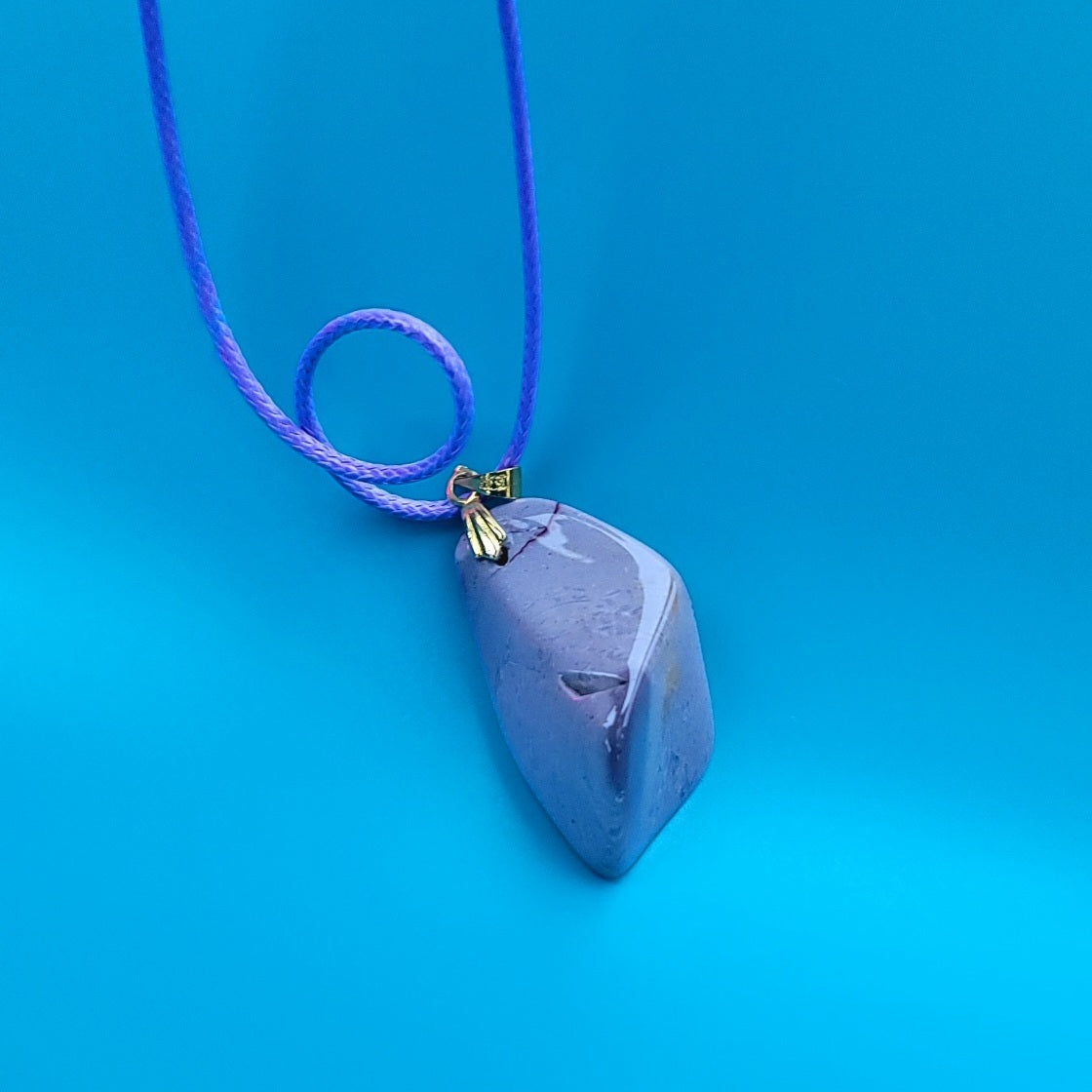 Experience the stunning natural beauty of our Desert Jasper Pendant. With its unique polychrome patterns and hues, this pendant is truly one-of-a-kind.