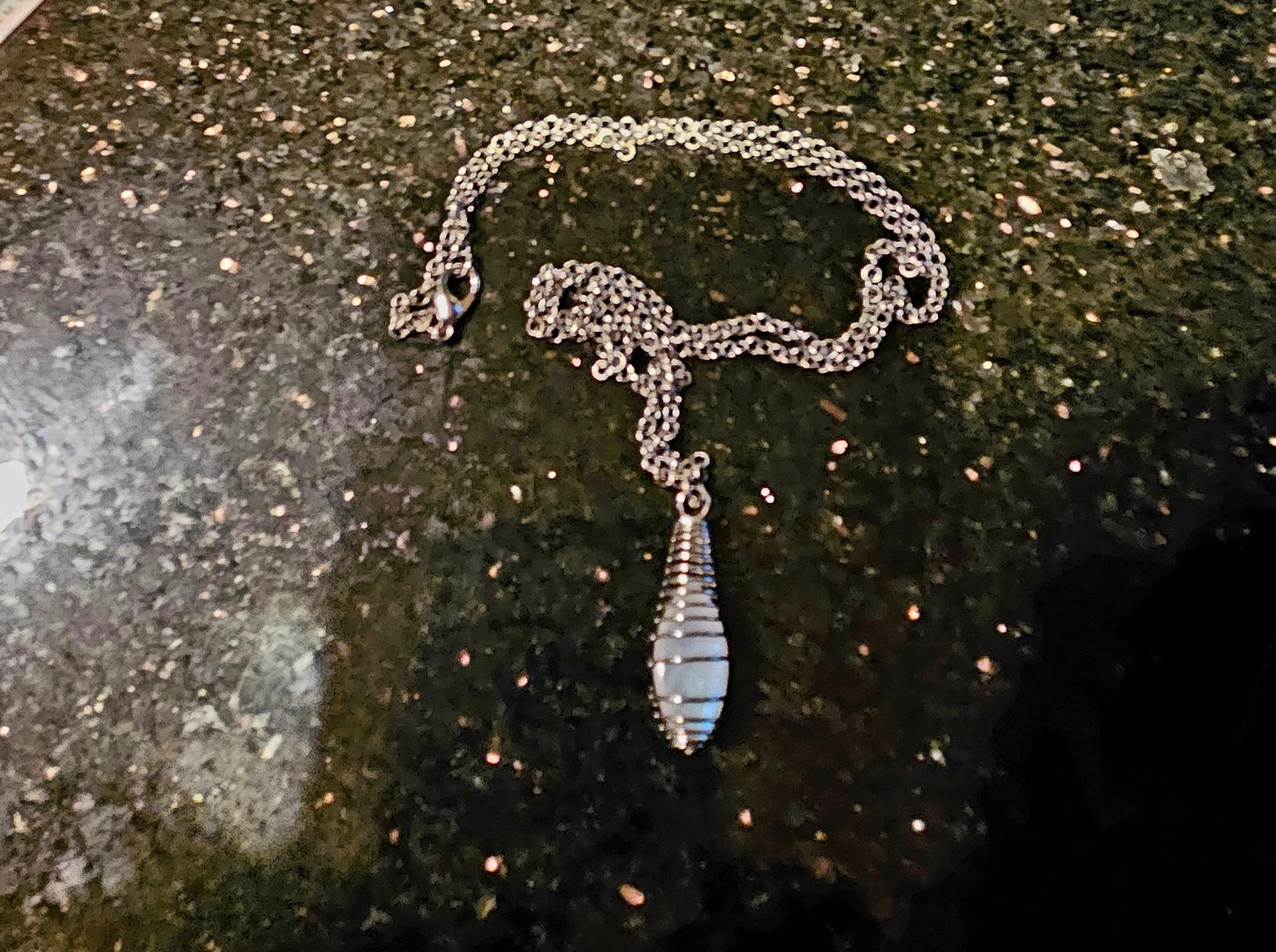 Cute and Elegant Opalite spiral cage pendant. Perfect holiday gift for mom, Sister or other friend or family member.