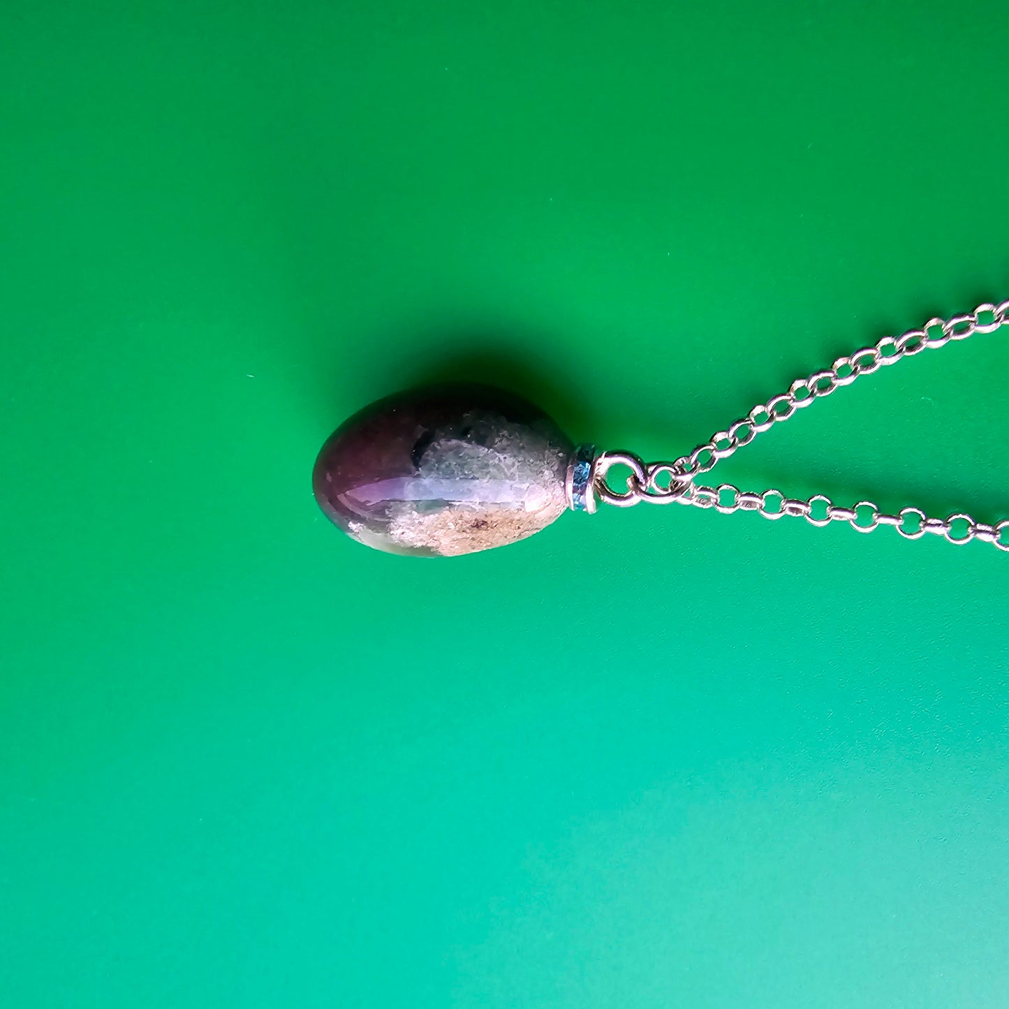 Beautiful, multicolored green Jasper Pendant. This pendant has very unique color patterns which makes it one of a kind.