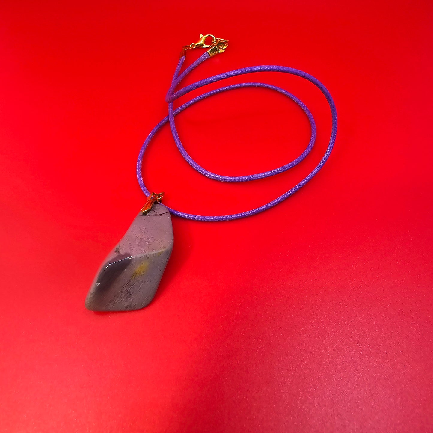 Experience the stunning natural beauty of our Desert Jasper Pendant. With its unique polychrome patterns and hues, this pendant is truly one-of-a-kind.