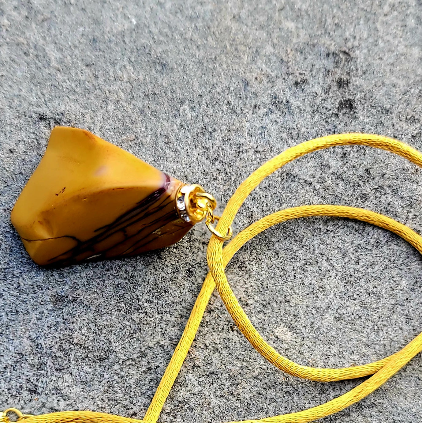 CAPTURE AN AMAZING PIECE OF NATURAL BEAUTY WITH THIS YELLOW JASPER PENDANT..