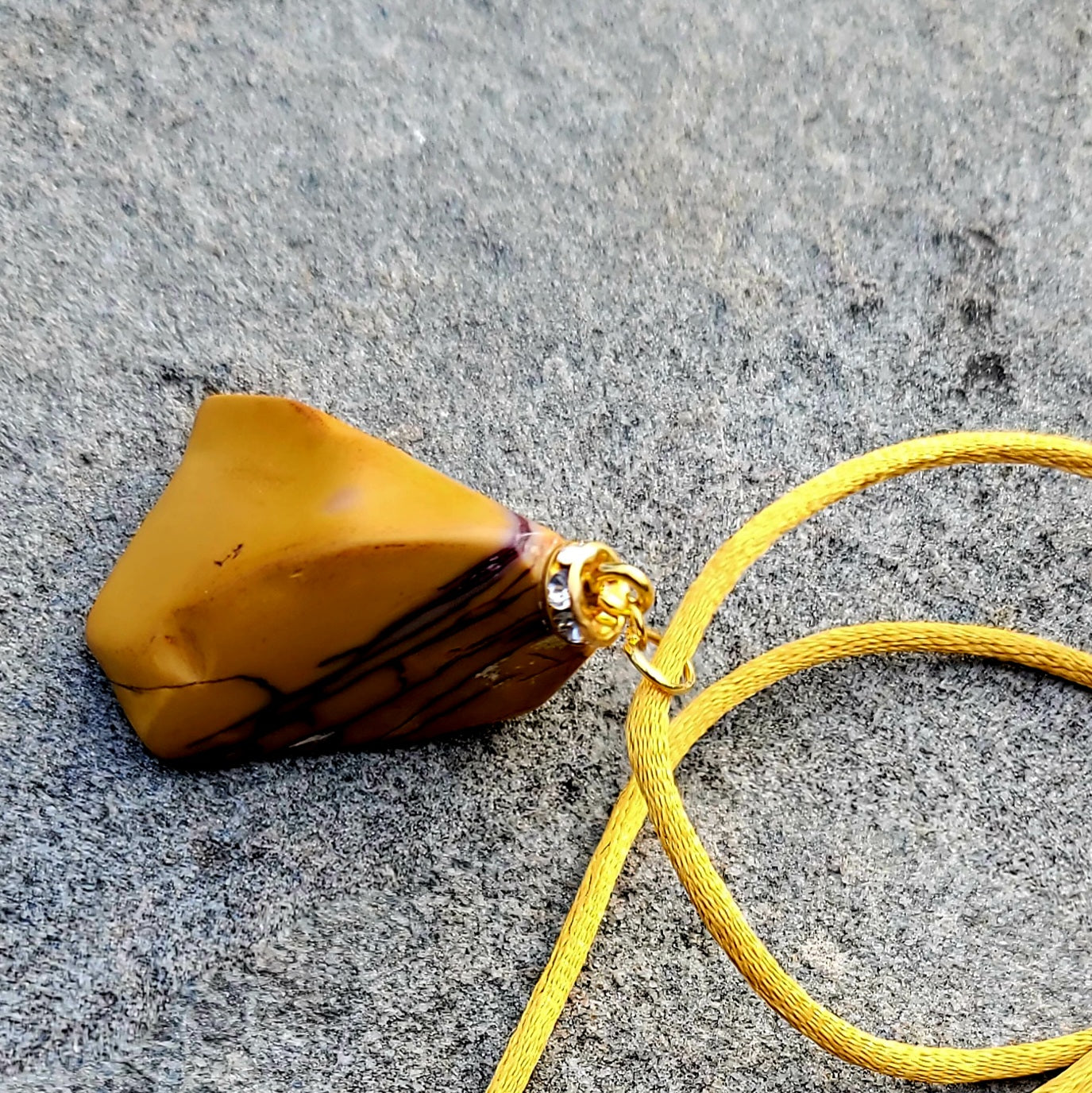 CAPTURE AN AMAZING PIECE OF NATURAL BEAUTY WITH THIS YELLOW JASPER PENDANT..