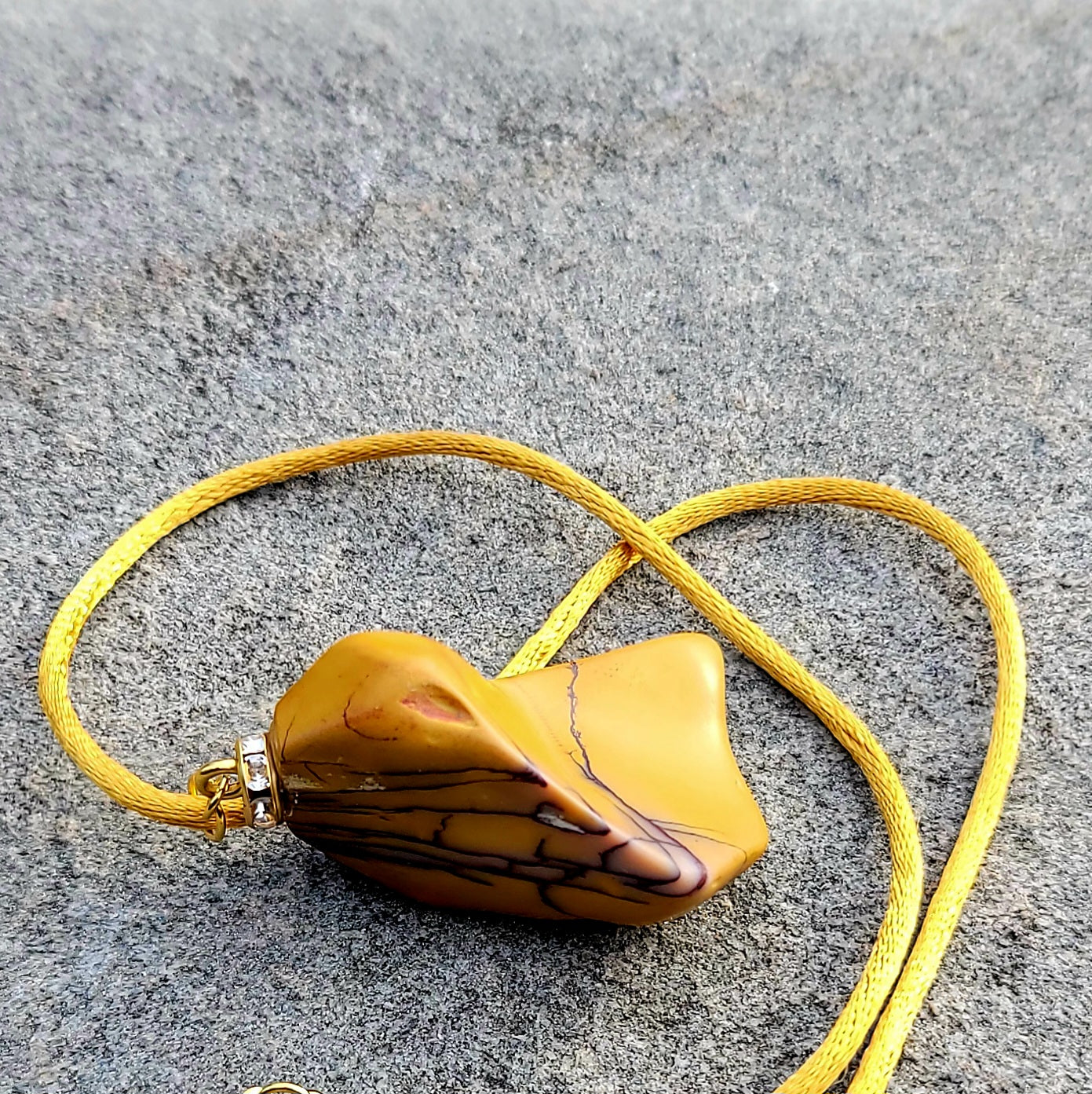 CAPTURE AN AMAZING PIECE OF NATURAL BEAUTY WITH THIS YELLOW JASPER PENDANT..