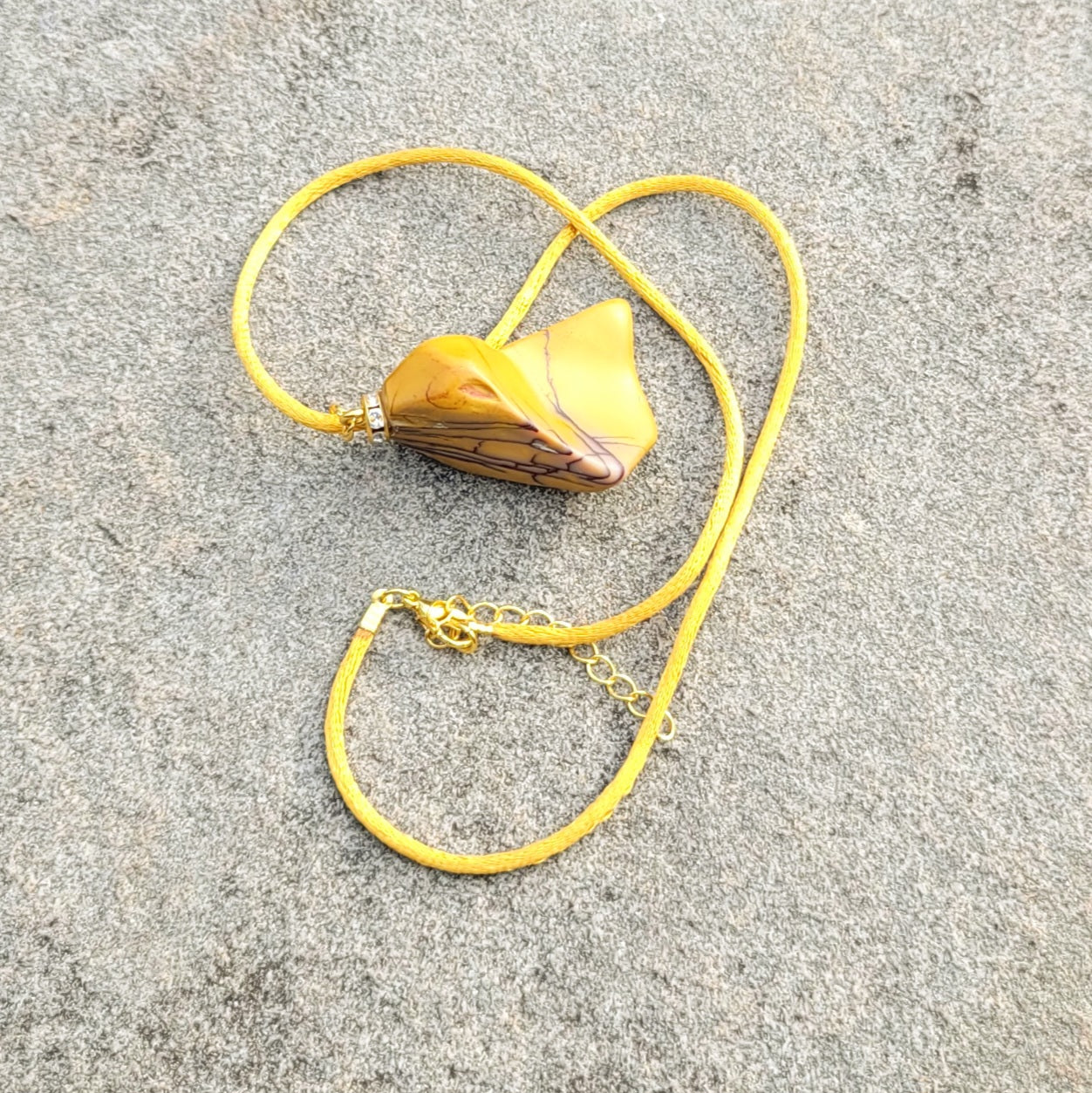 CAPTURE AN AMAZING PIECE OF NATURAL BEAUTY WITH THIS YELLOW JASPER PENDANT..