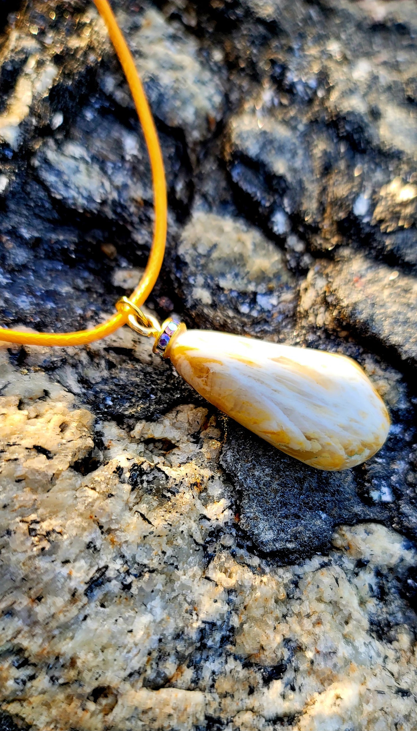 Golden Yellow quartz pendant. When you get this, take a good look into the stone and be amazed by the intricate patterns that were formed hundreds of thousands of years ago.