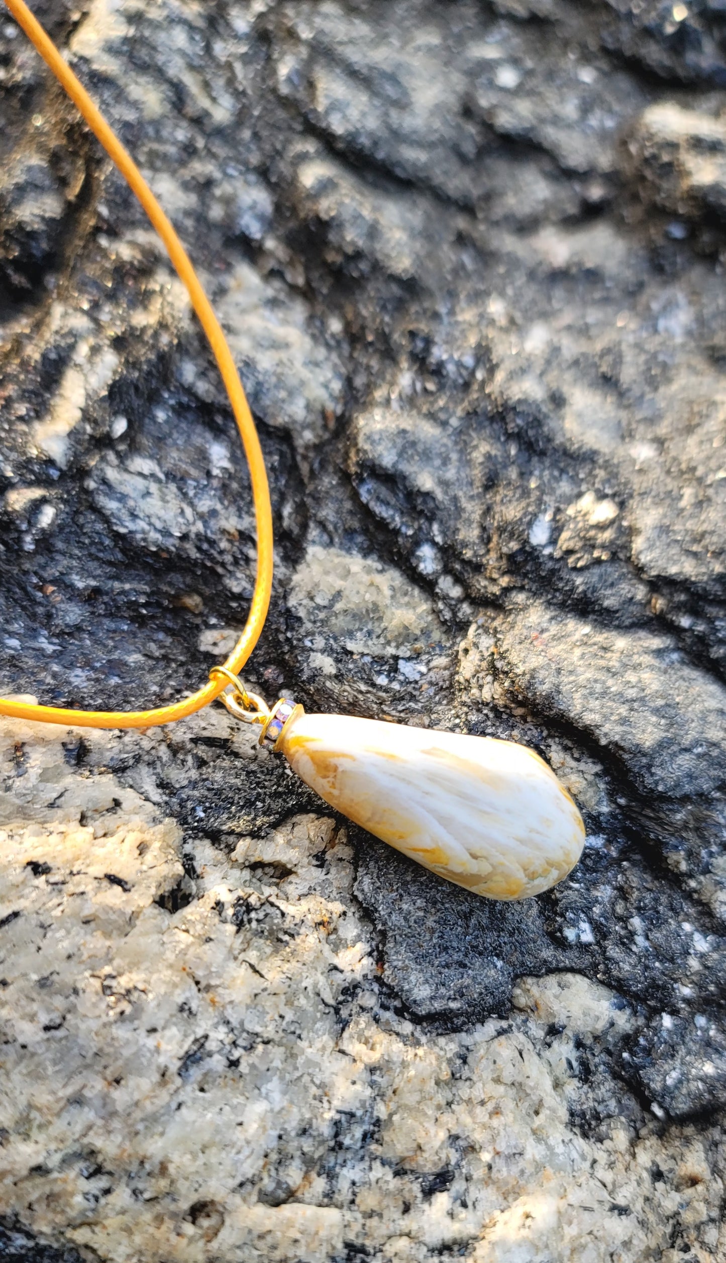 Golden Yellow quartz pendant. When you get this, take a good look into the stone and be amazed by the intricate patterns that were formed hundreds of thousands of years ago.