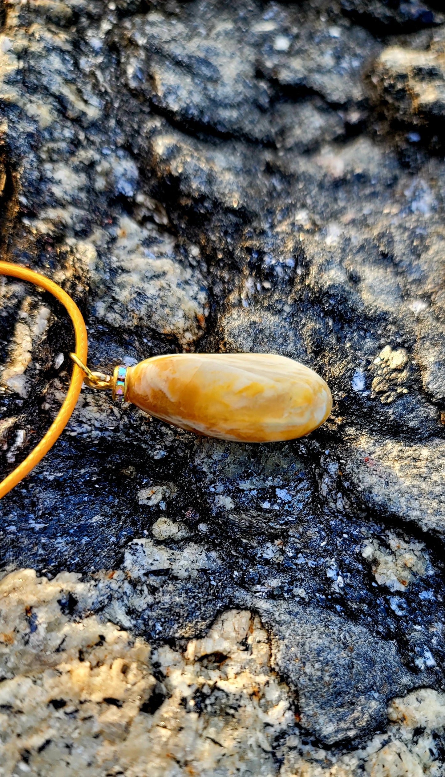 Golden Yellow quartz pendant. When you get this, take a good look into the stone and be amazed by the intricate patterns that were formed hundreds of thousands of years ago.