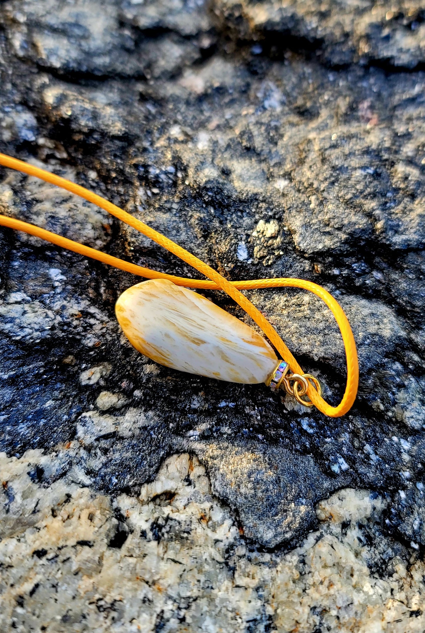 Golden Yellow quartz pendant. When you get this, take a good look into the stone and be amazed by the intricate patterns that were formed hundreds of thousands of years ago.