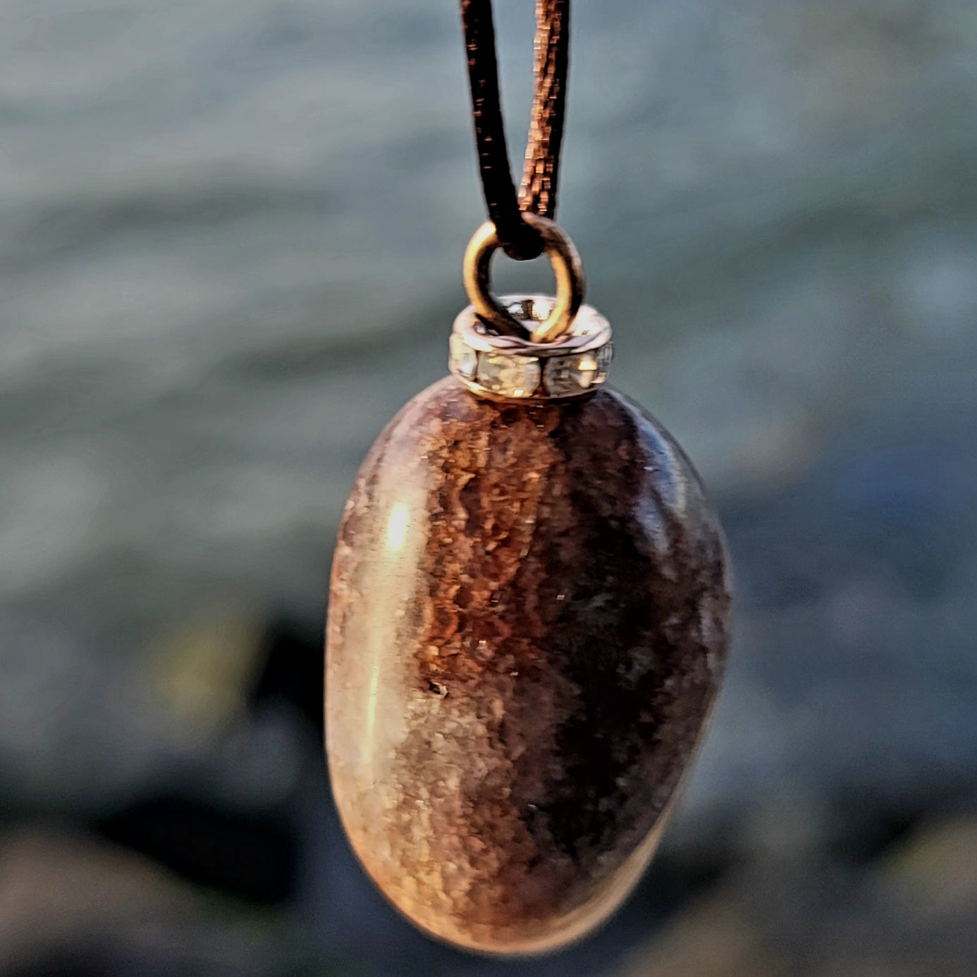 Mesmerizing Strawberry Quartz pendant. Hold it up to reveal what looks like strawberry seeds suspended in glass. Great piece for you or as a gift to someone special