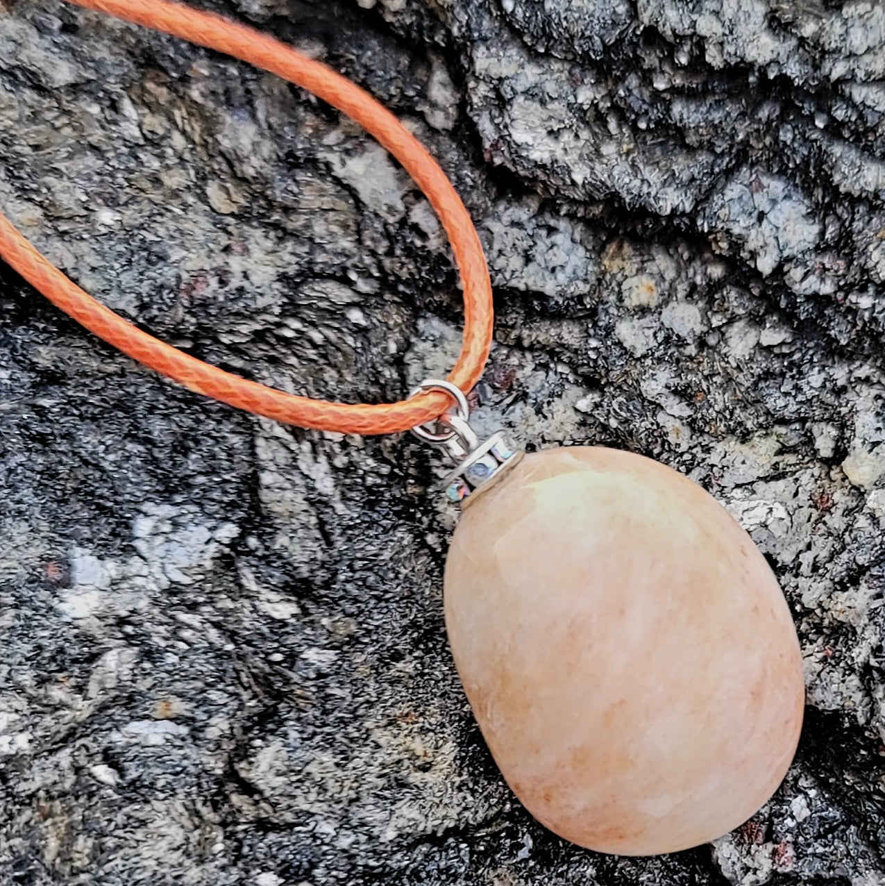 Orange quartz gemstone pendant. This aventurine based quartz piece is simple, straightforward and beautiful. great addition to your wardrobe, or to give as a gift.