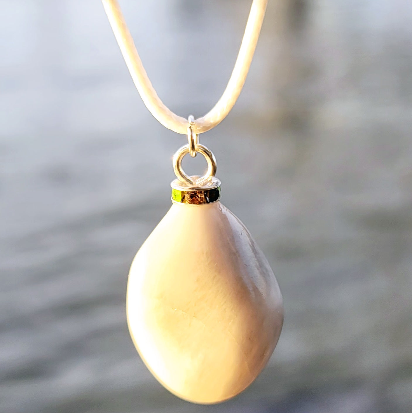 SLEEK MILKY QUARTZ PENDANT THAT IS AS VERSATILE AS A TUXEDO OR BLACK DRESS!