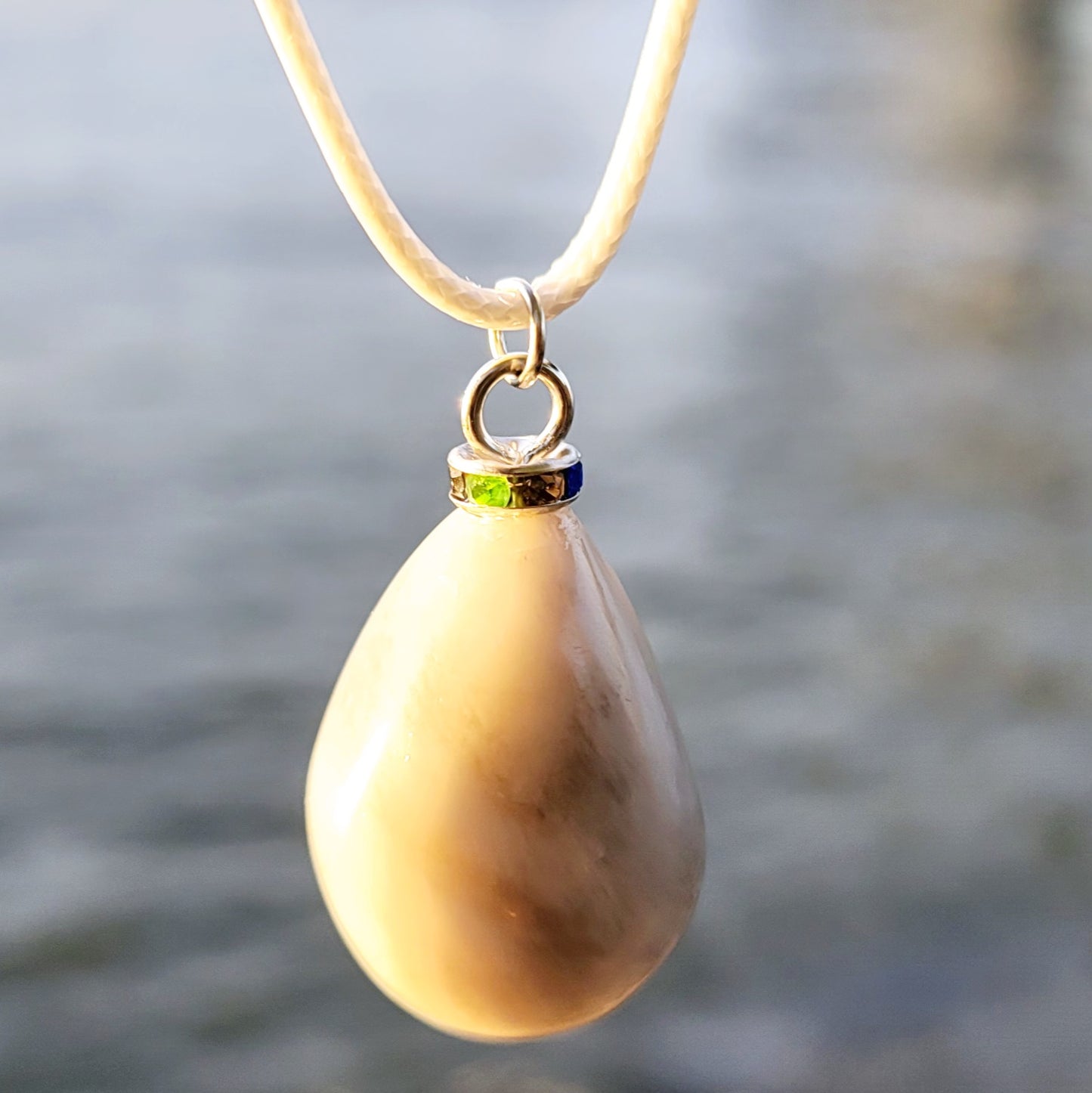 SLEEK MILKY QUARTZ PENDANT THAT IS AS VERSATILE AS A TUXEDO OR BLACK DRESS!