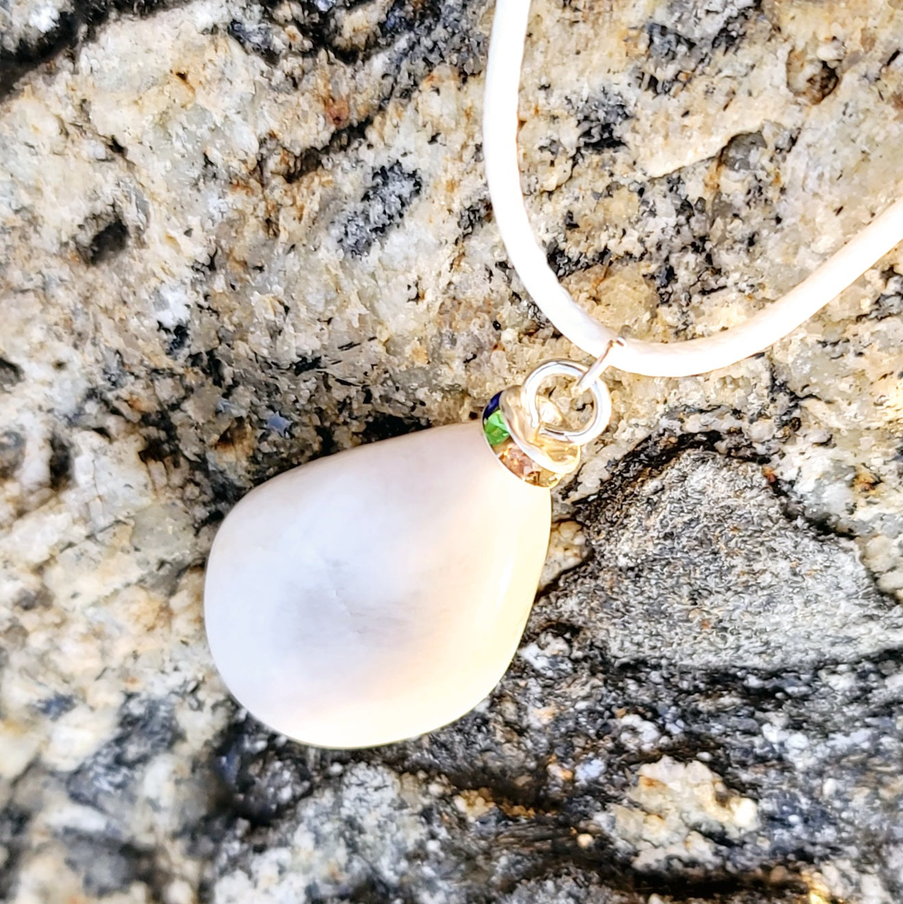 SLEEK MILKY QUARTZ PENDANT THAT IS AS VERSATILE AS A TUXEDO OR BLACK DRESS!