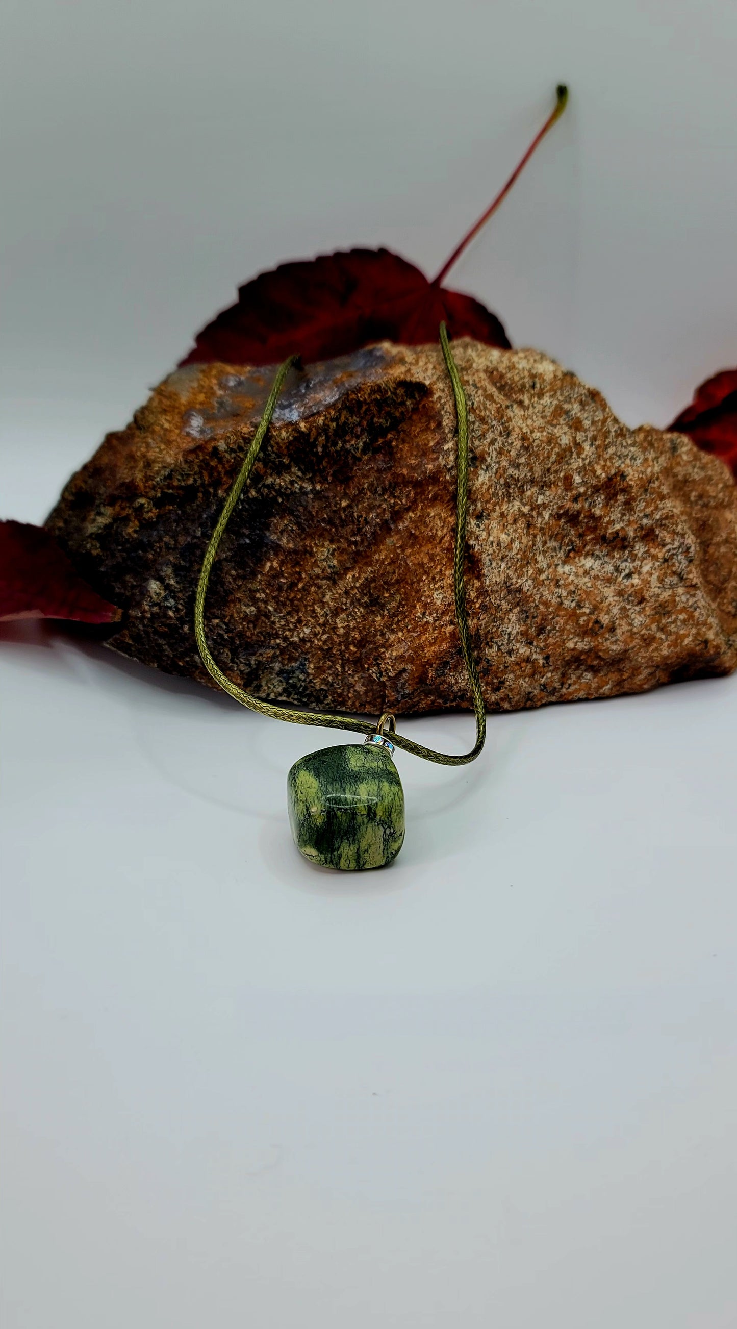 This Green serpentine pendant is filled with intricate patterns that will dazzle and amaze. Gret as a gift item this holiday and beyond.