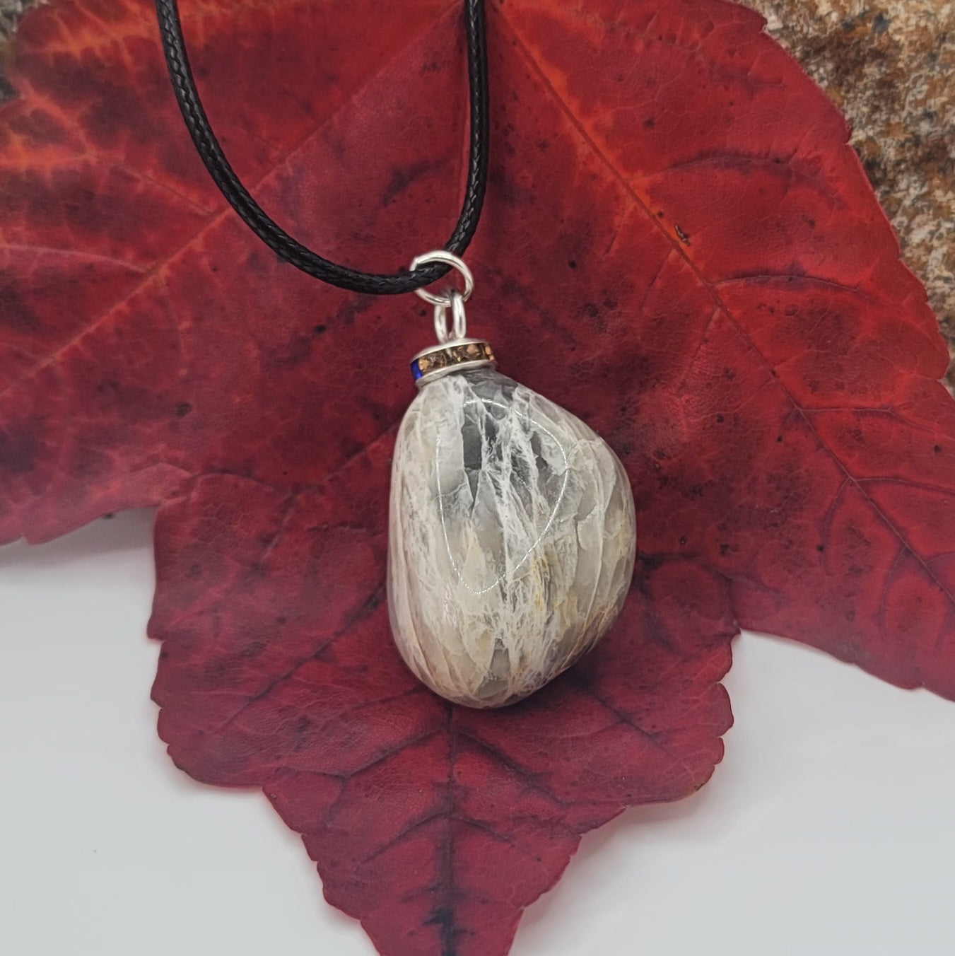 Check out this very unique Black Moonstone pendant. Its intricate array of banded lines makes for a fascinating gaze.