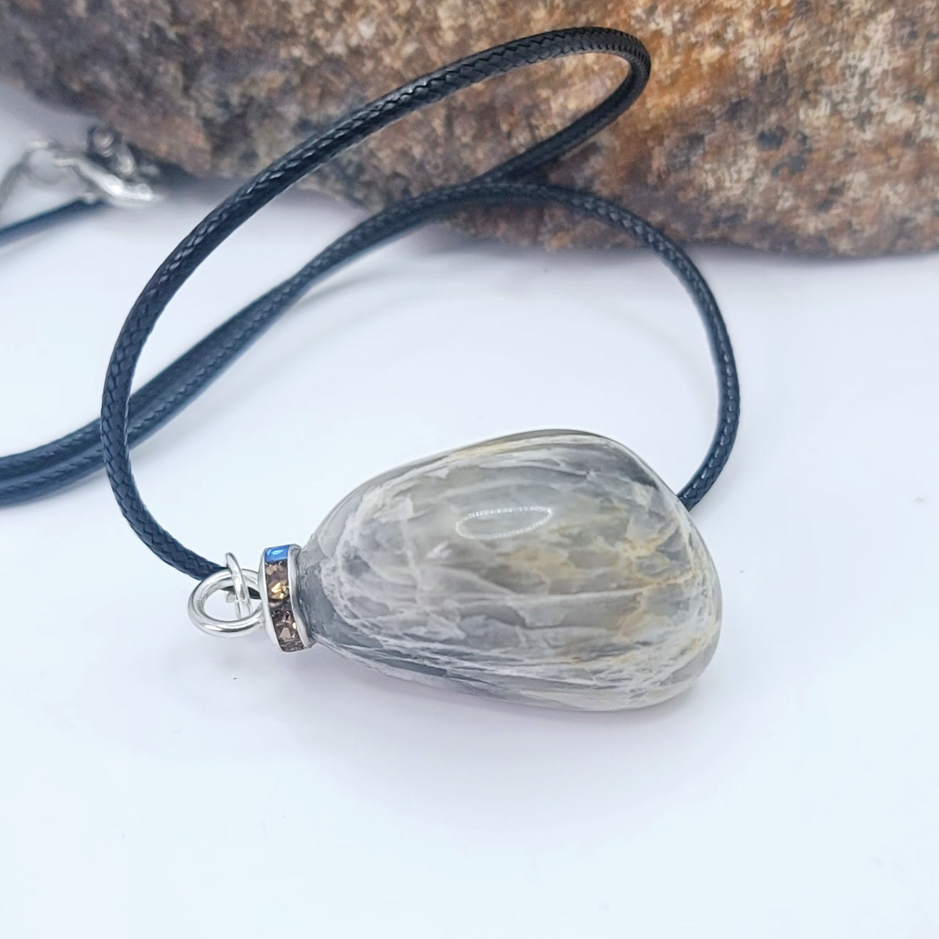 Check out this very unique Black Moonstone pendant. Its intricate array of banded lines makes for a fascinating gaze.