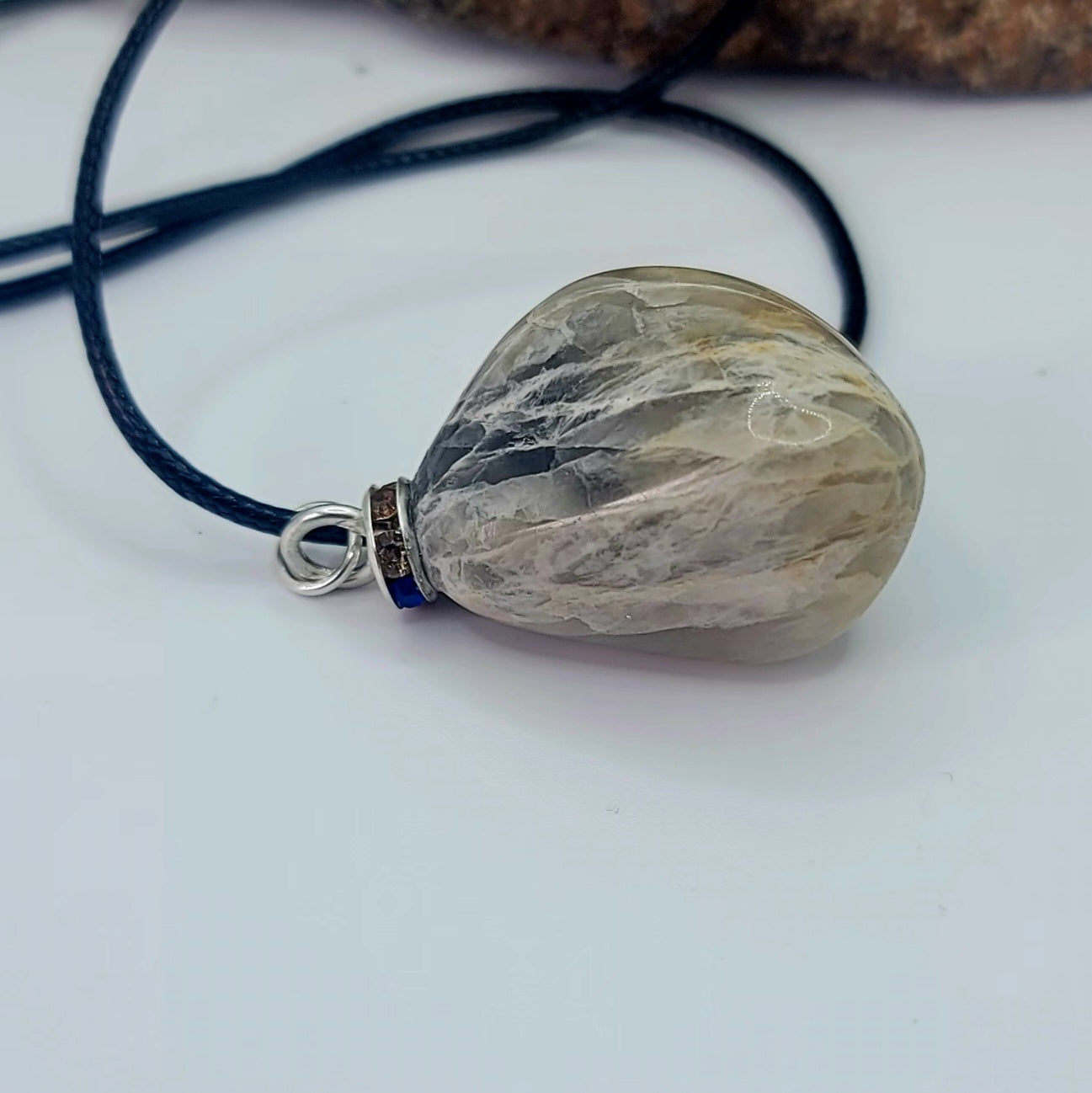 Check out this very unique Black Moonstone pendant. Its intricate array of banded lines makes for a fascinating gaze.