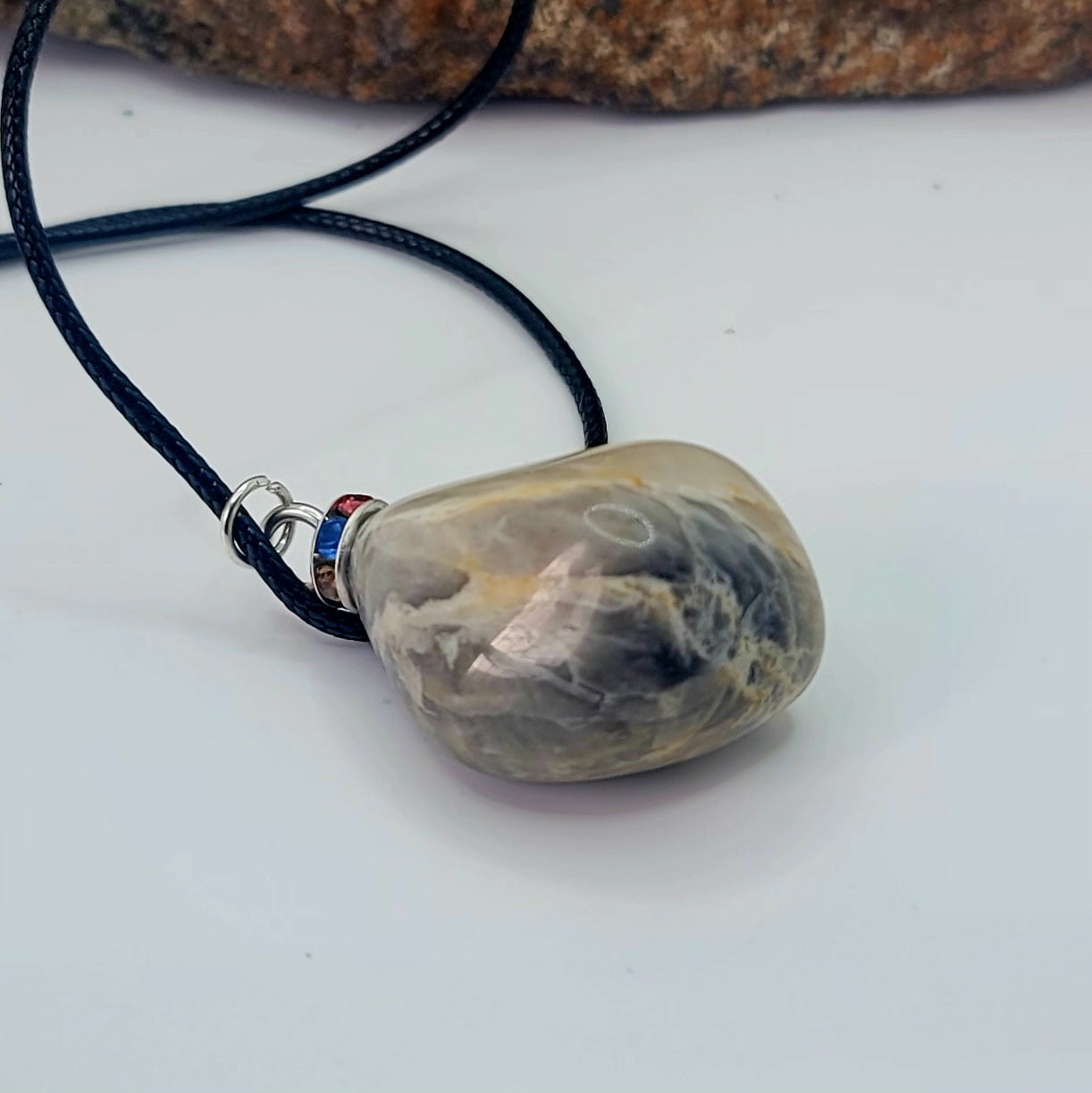 Check out this very unique Black Moonstone pendant. Its intricate array of banded lines makes for a fascinating gaze.