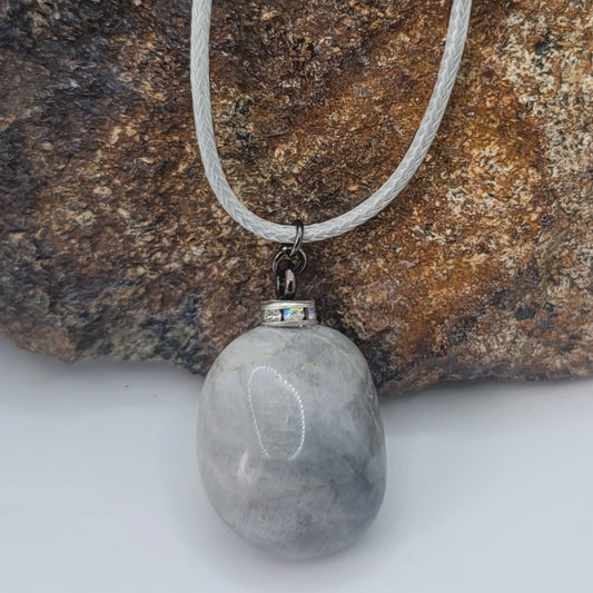 Make a simple but clear statement with this beautiful Grey and white quartz gemstone pendant. It's a wonderful piece to add to your collection or gift to someone this holiday and beyond.