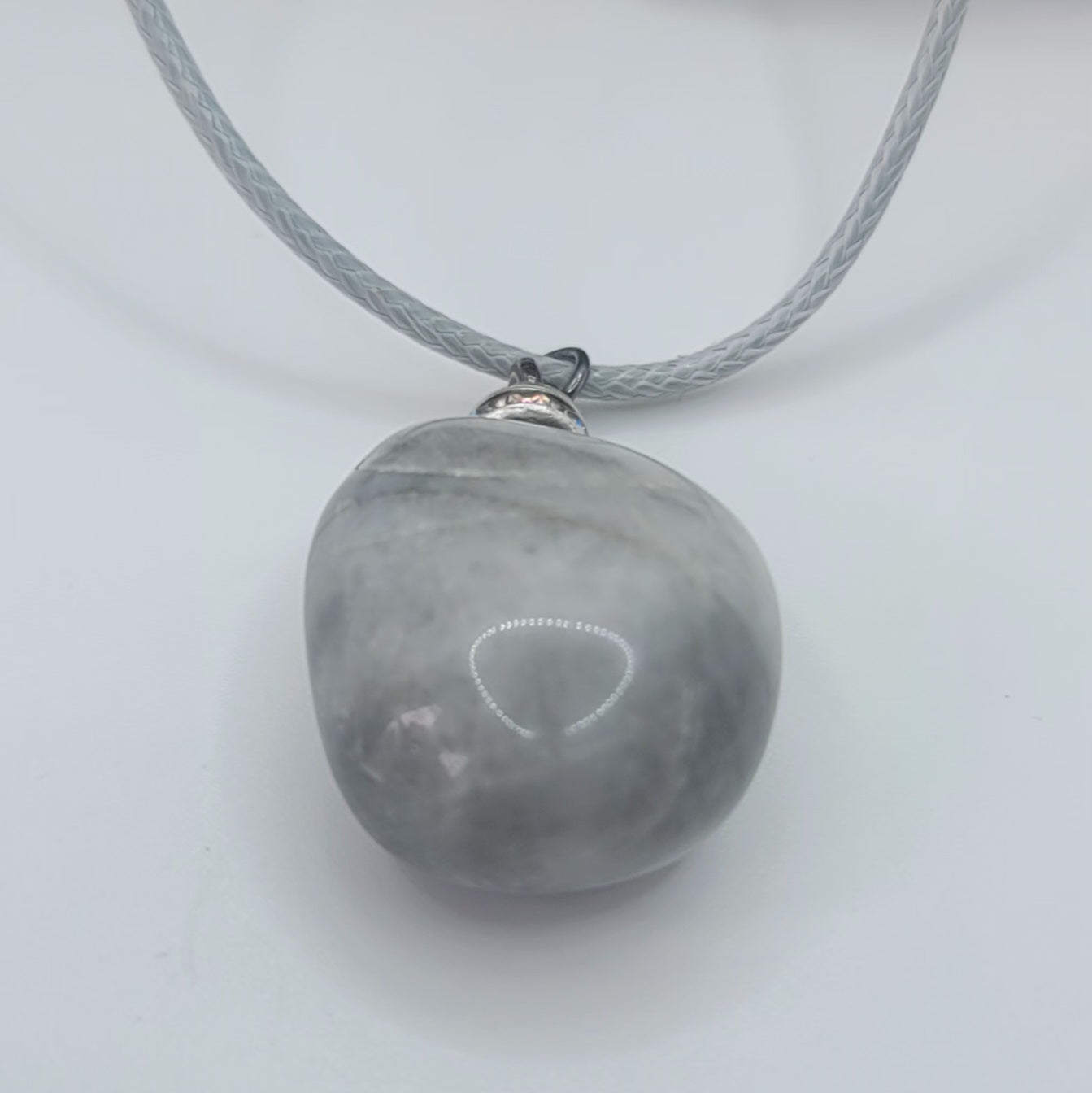 Make a simple but clear statement with this beautiful Grey and white quartz gemstone pendant. It's a wonderful piece to add to your collection or gift to someone this holiday and beyond.