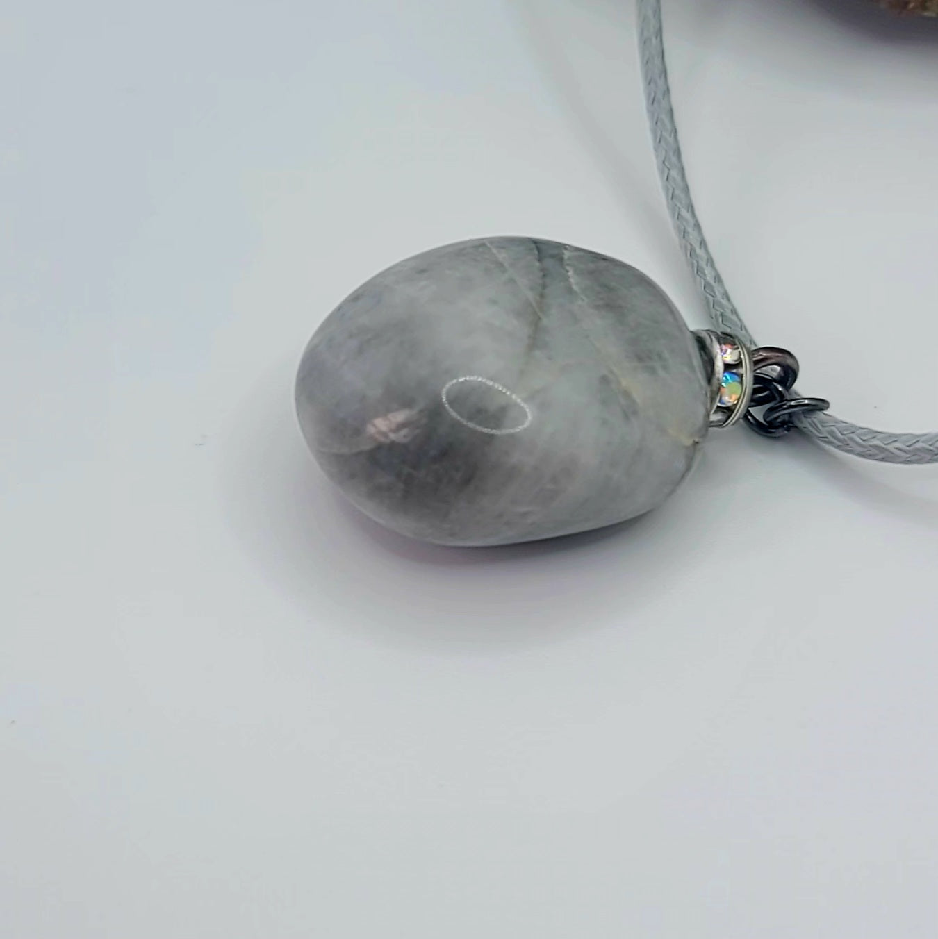 Make a simple but clear statement with this beautiful Grey and white quartz gemstone pendant. It's a wonderful piece to add to your collection or gift to someone this holiday and beyond.