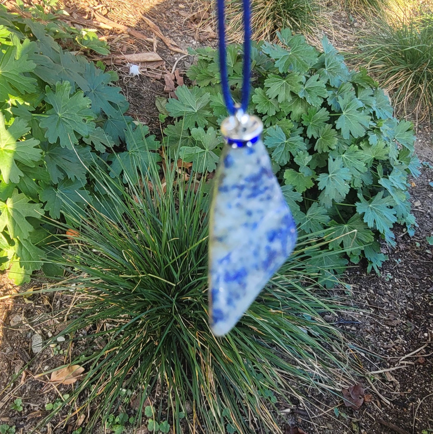 THIS MYSTIC LAPIS LAZULI PENDANT IS SURE TO EQUALLY INTRIGUE AND DELIGHT.