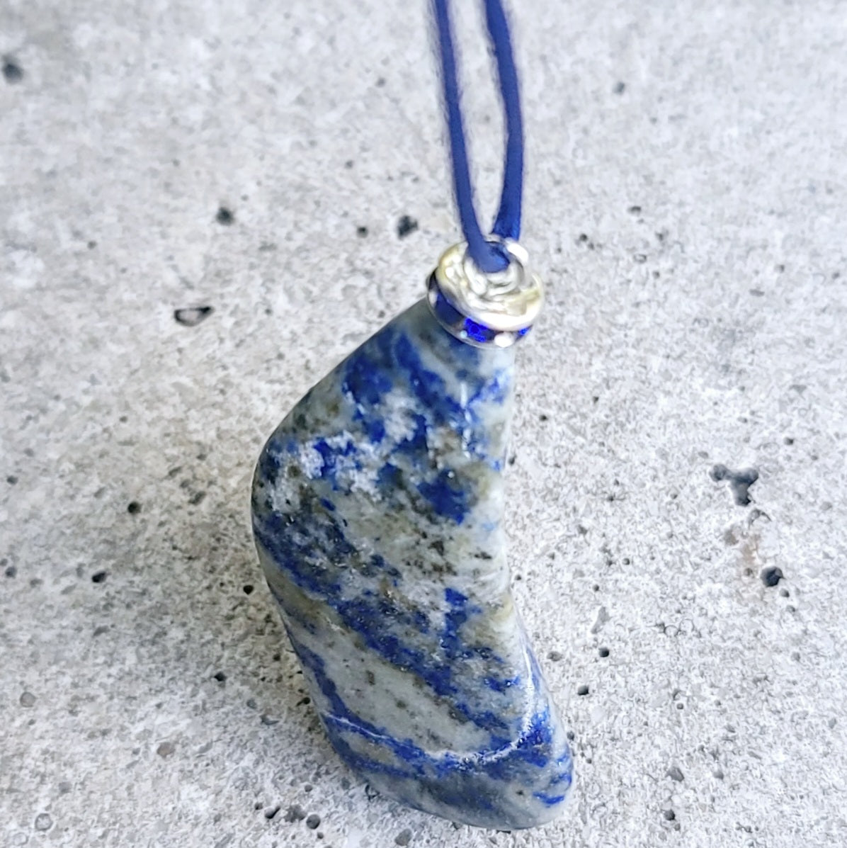 THIS MYSTIC LAPIS LAZULI PENDANT IS SURE TO EQUALLY INTRIGUE AND DELIGHT.