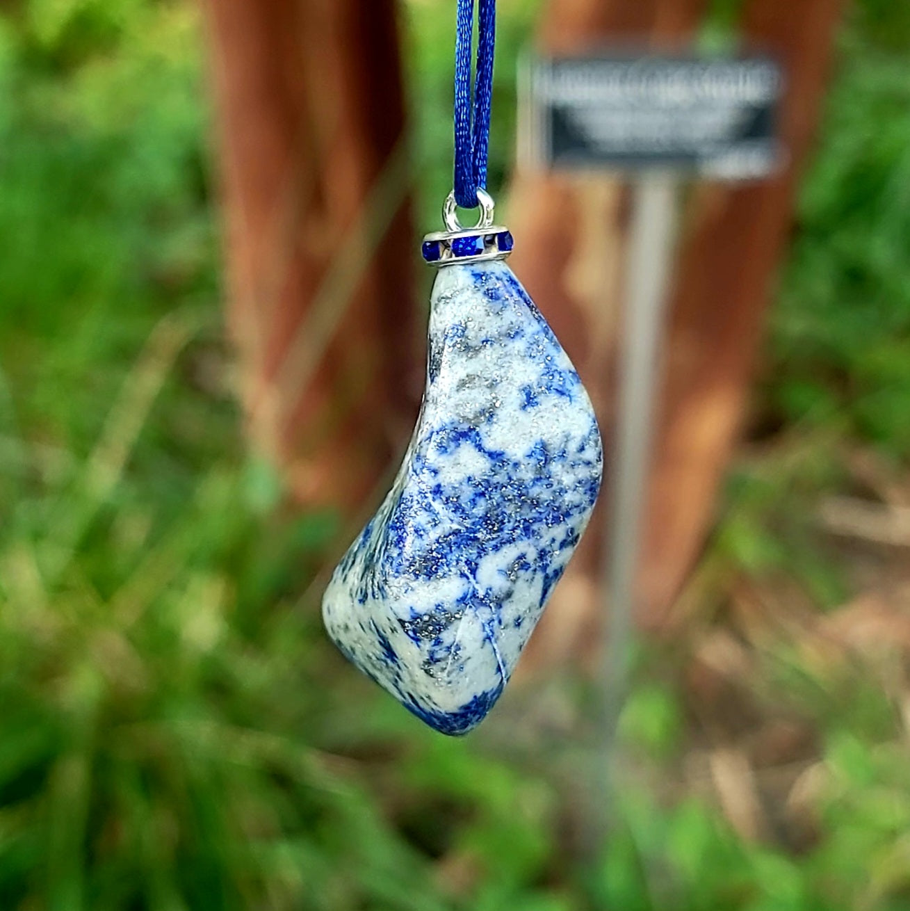 THIS MYSTIC LAPIS LAZULI PENDANT IS SURE TO EQUALLY INTRIGUE AND DELIGHT.