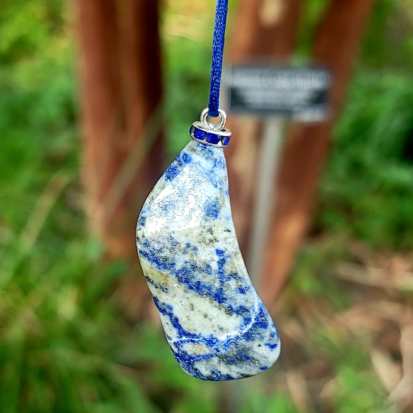 THIS MYSTIC LAPIS LAZULI PENDANT IS SURE TO EQUALLY INTRIGUE AND DELIGHT.