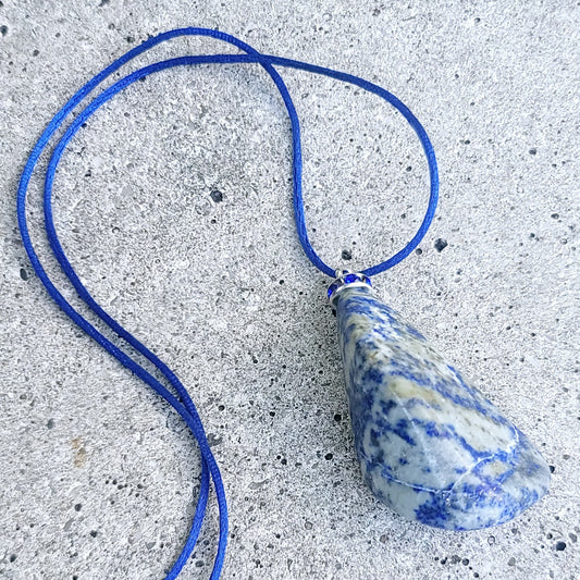 THIS MYSTIC LAPIS LAZULI PENDANT IS SURE TO EQUALLY INTRIGUE AND DELIGHT.