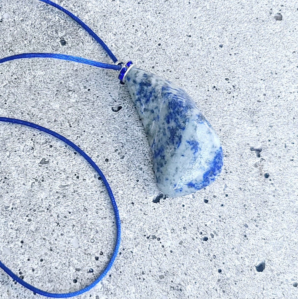 THIS MYSTIC LAPIS LAZULI PENDANT IS SURE TO EQUALLY INTRIGUE AND DELIGHT.