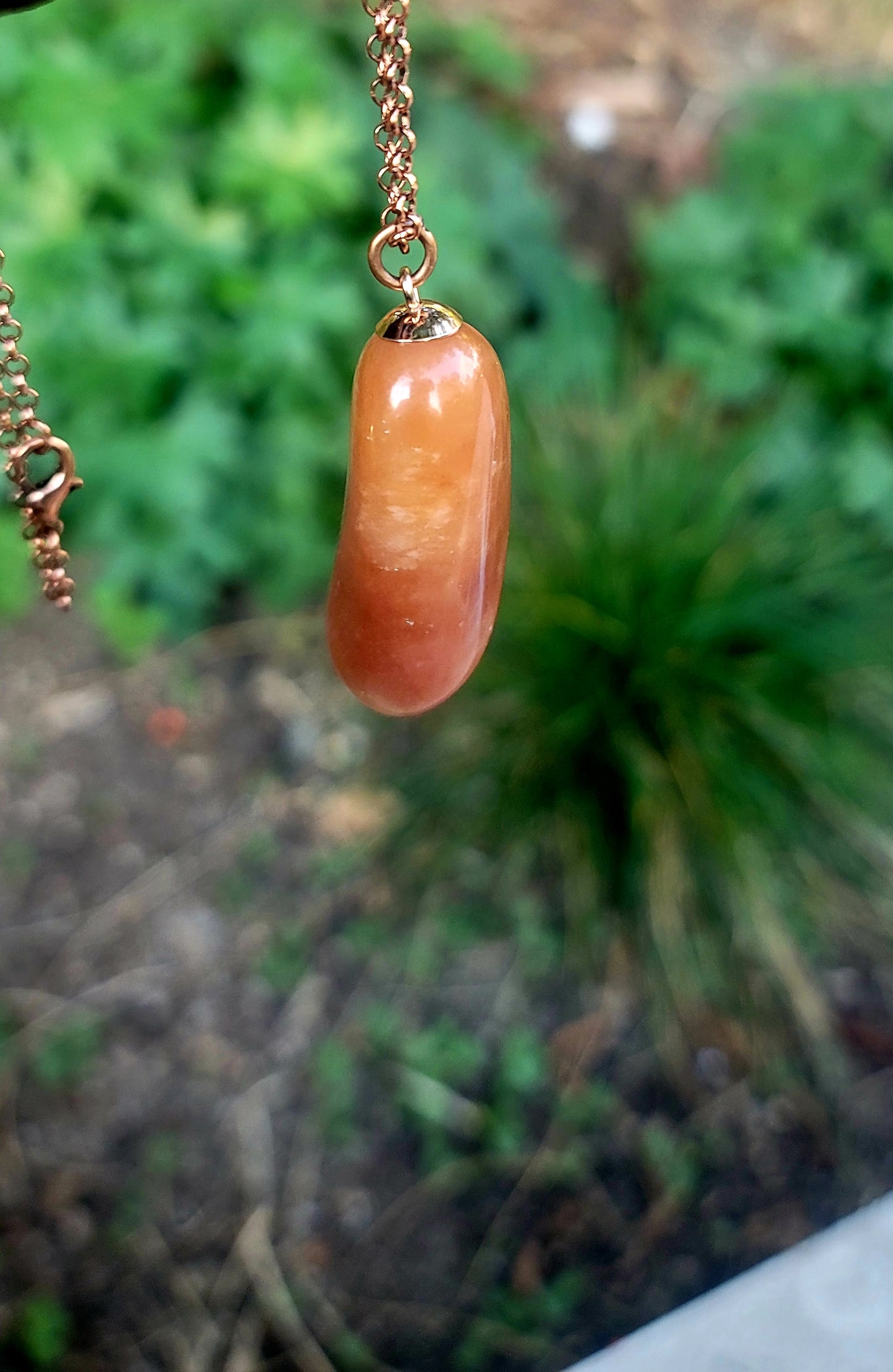 REDDISH-BROWN QUARTZ PENDANT