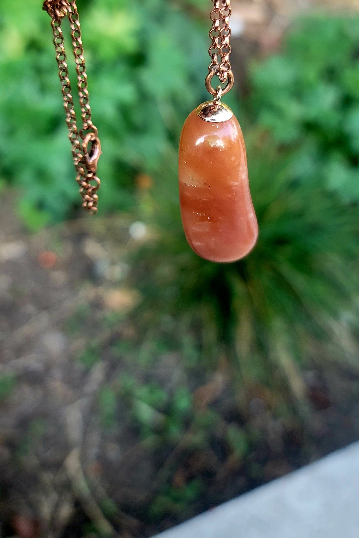 REDDISH-BROWN QUARTZ PENDANT