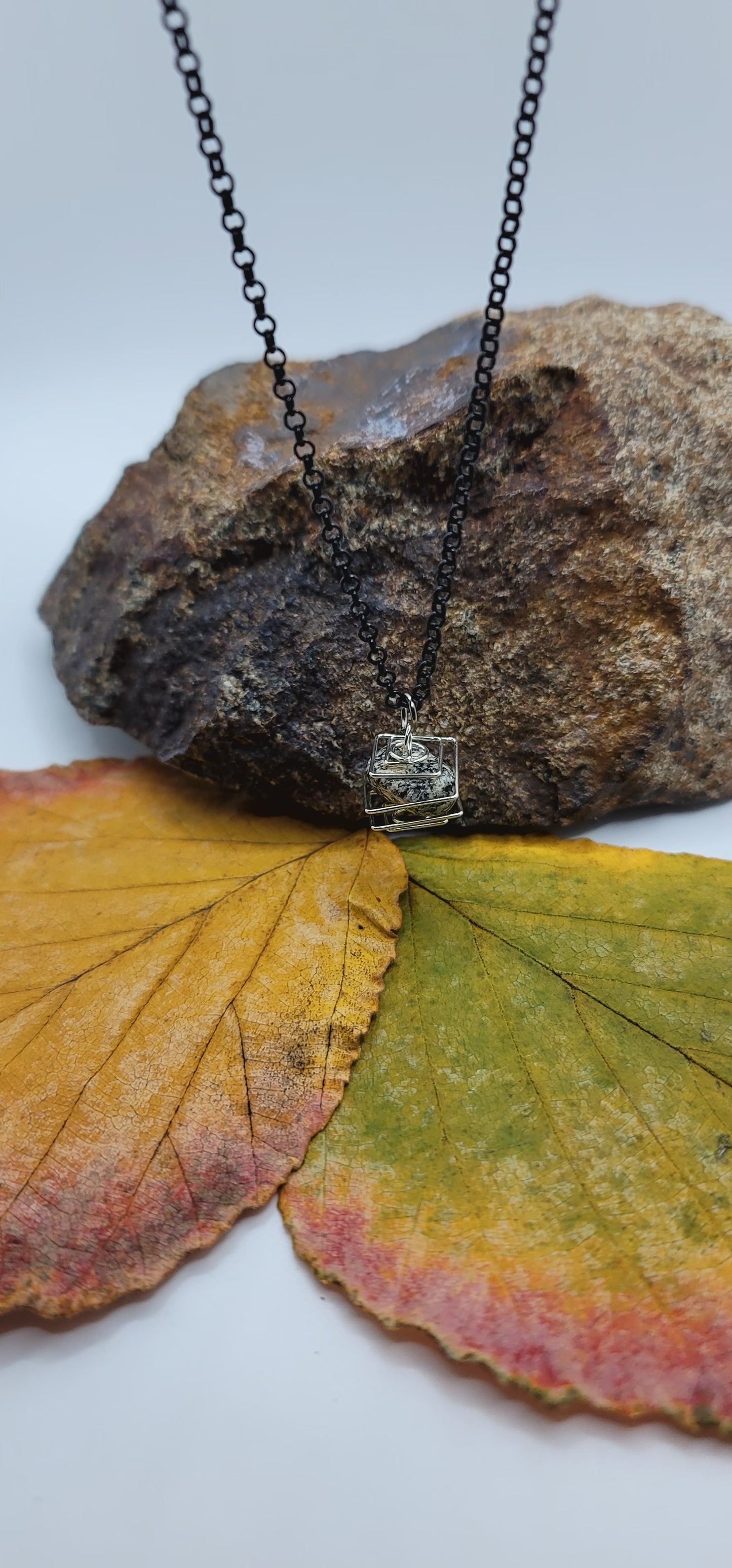 Delightful Square Cage Dalmatian Stone necklace. Despite its size, this is an eye catcher. Perfect little gift for that special someone.