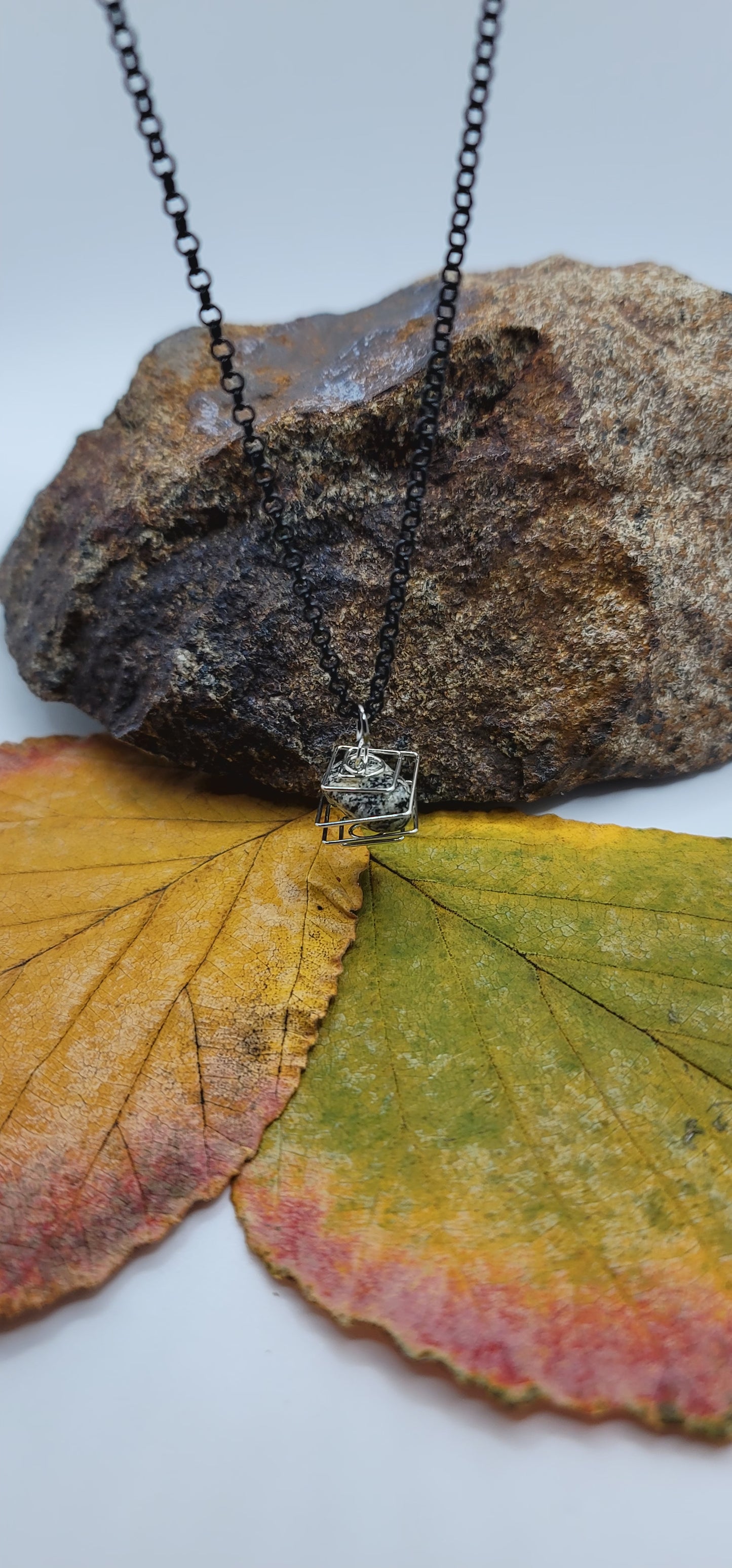 Delightful Square Cage Dalmatian Stone necklace. Despite its size, this is an eye catcher. Perfect little gift for that special someone.