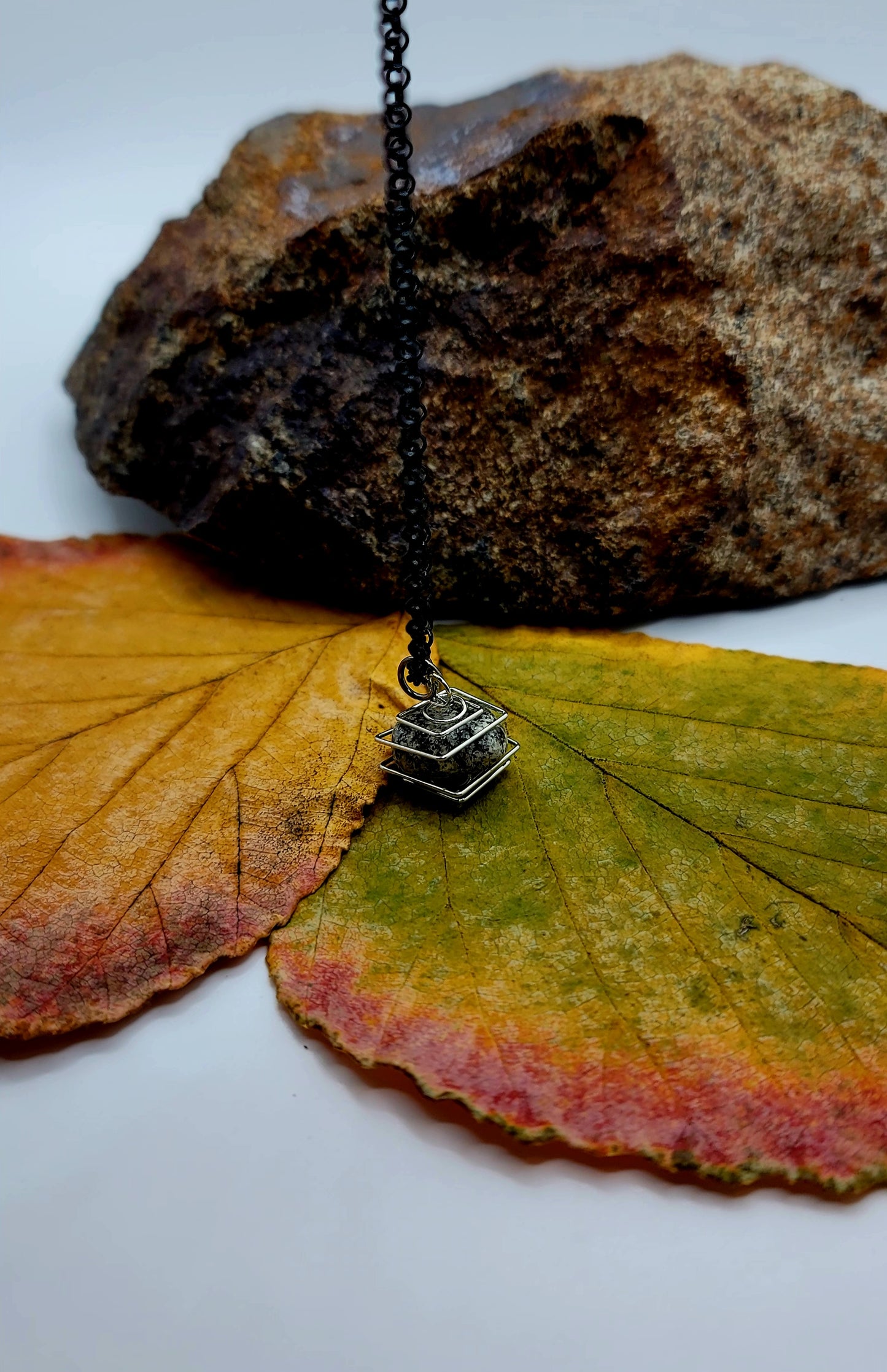 Delightful Square Cage Dalmatian Stone necklace. Despite its size, this is an eye catcher. Perfect little gift for that special someone.