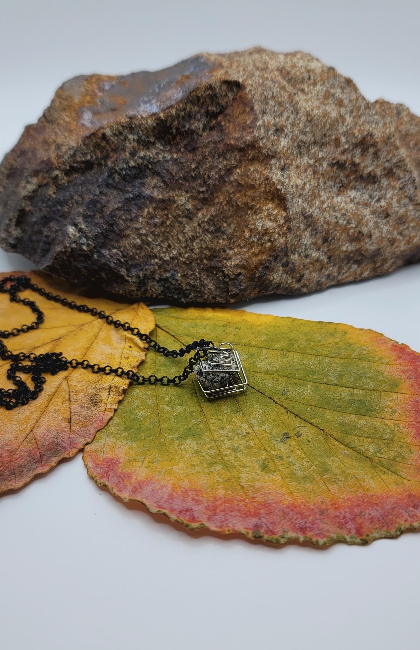 Delightful Square Cage Dalmatian Stone necklace. Despite its size, this is an eye catcher. Perfect little gift for that special someone.