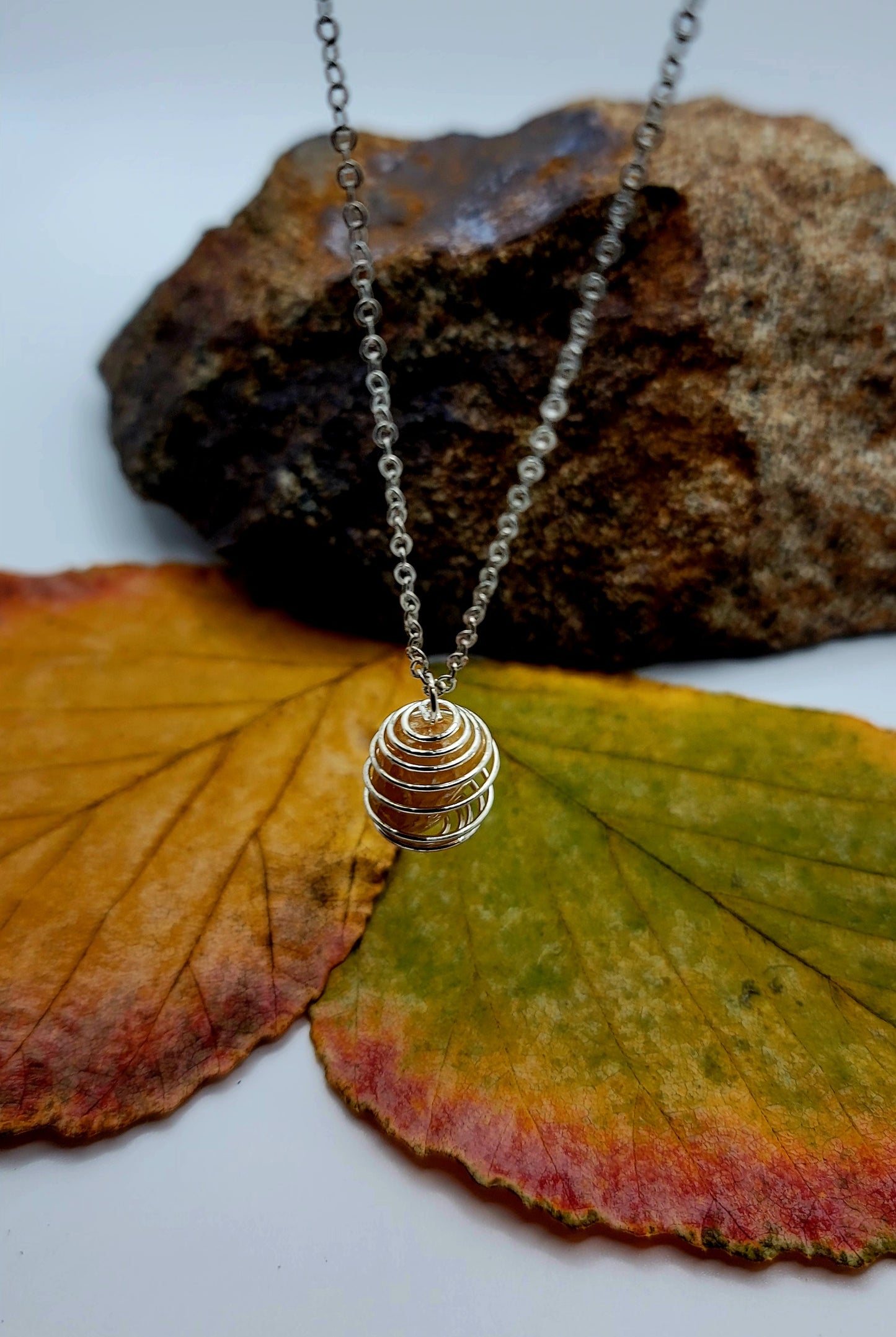 THIS IS A BEAUTIFUL GOLDEN QUARTZ SPIRAL CAGE NECKLACE