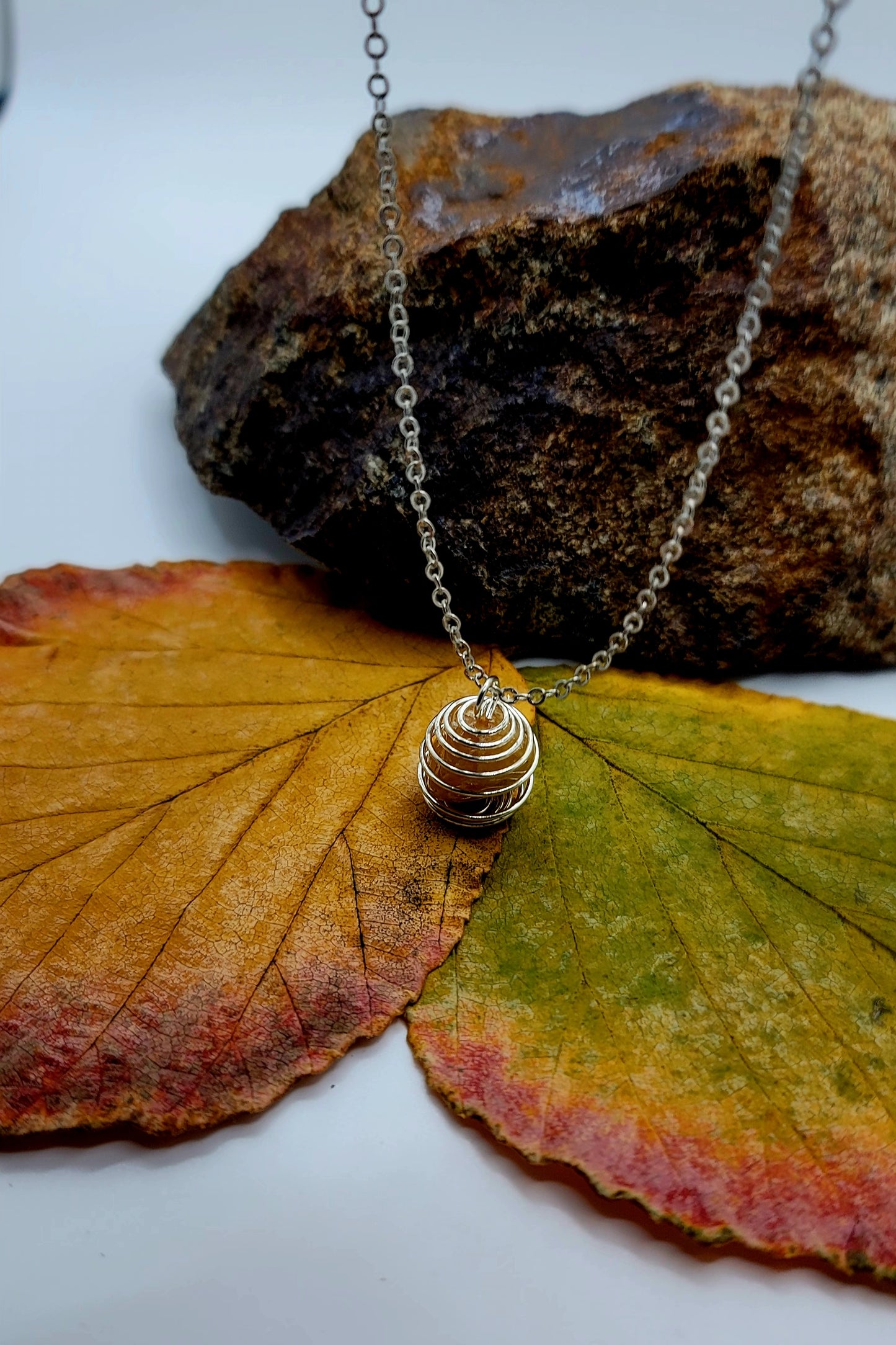 THIS IS A BEAUTIFUL GOLDEN QUARTZ SPIRAL CAGE NECKLACE