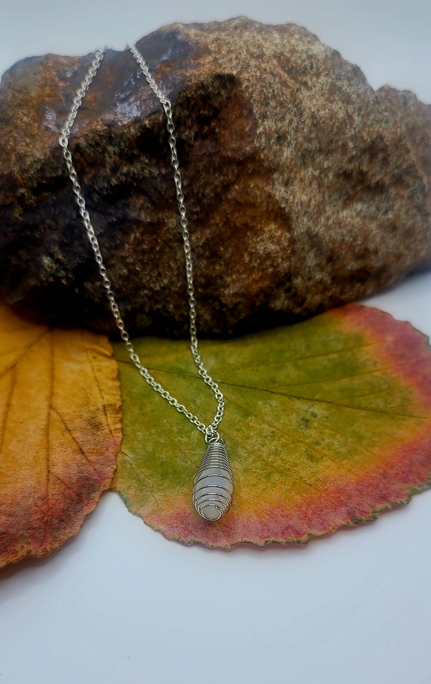 Cute and Elegant Opalite spiral cage pendant. Perfect holiday gift for mom, Sister or other friend or family member.