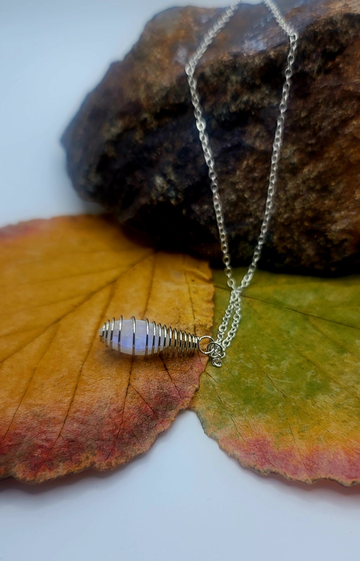 Cute and Elegant Opalite spiral cage pendant. Perfect holiday gift for mom, Sister or other friend or family member.