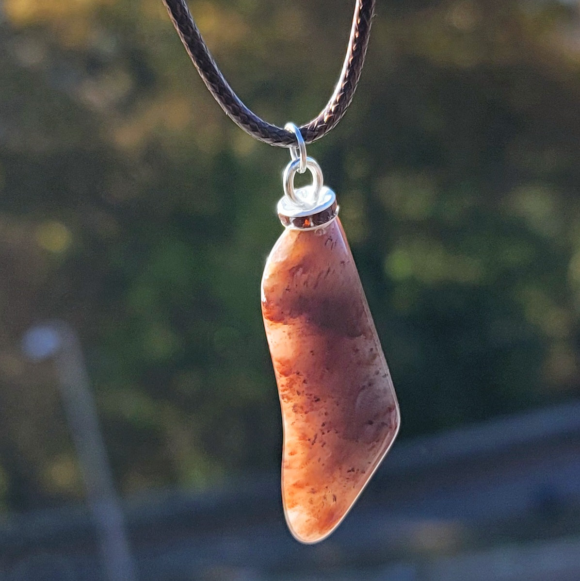 Intriguing Ferruginous Quartz Pendant. This unique piece will be a great gift for him or her this holiday season and beyond. Treat them today, or just treat yourself to it!