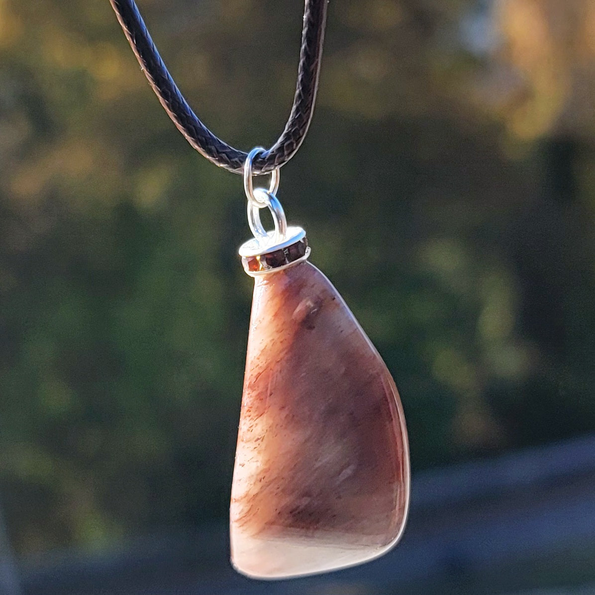 Intriguing Ferruginous Quartz Pendant. This unique piece will be a great gift for him or her this holiday season and beyond. Treat them today, or just treat yourself to it!