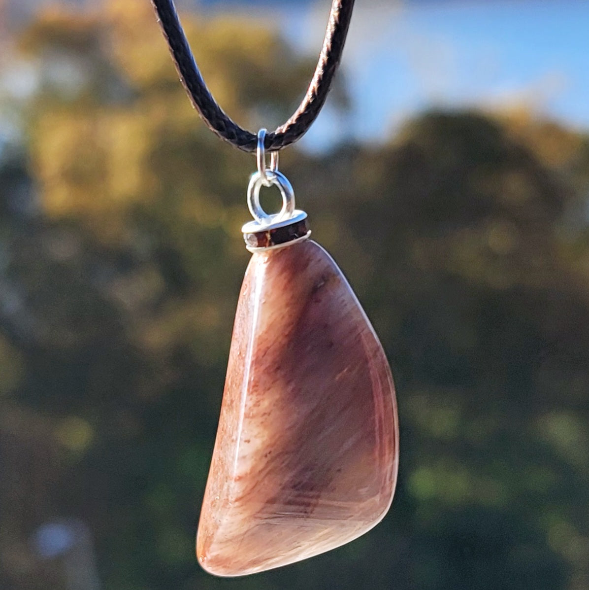 Intriguing Ferruginous Quartz Pendant. This unique piece will be a great gift for him or her this holiday season and beyond. Treat them today, or just treat yourself to it!