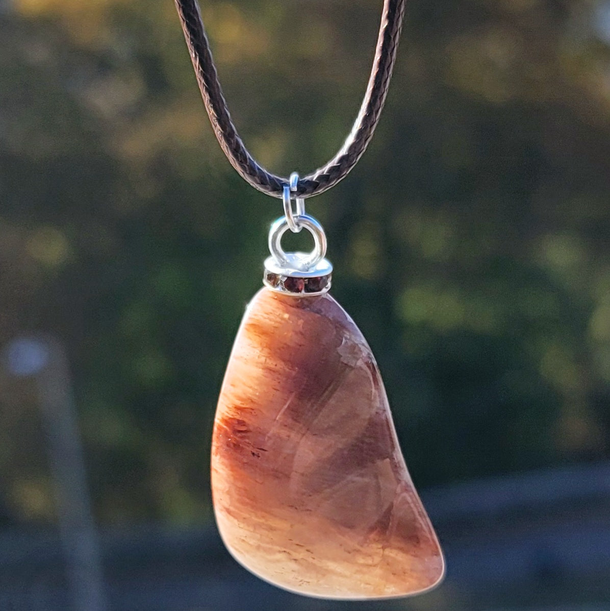 Intriguing Ferruginous Quartz Pendant. This unique piece will be a great gift for him or her this holiday season and beyond. Treat them today, or just treat yourself to it!