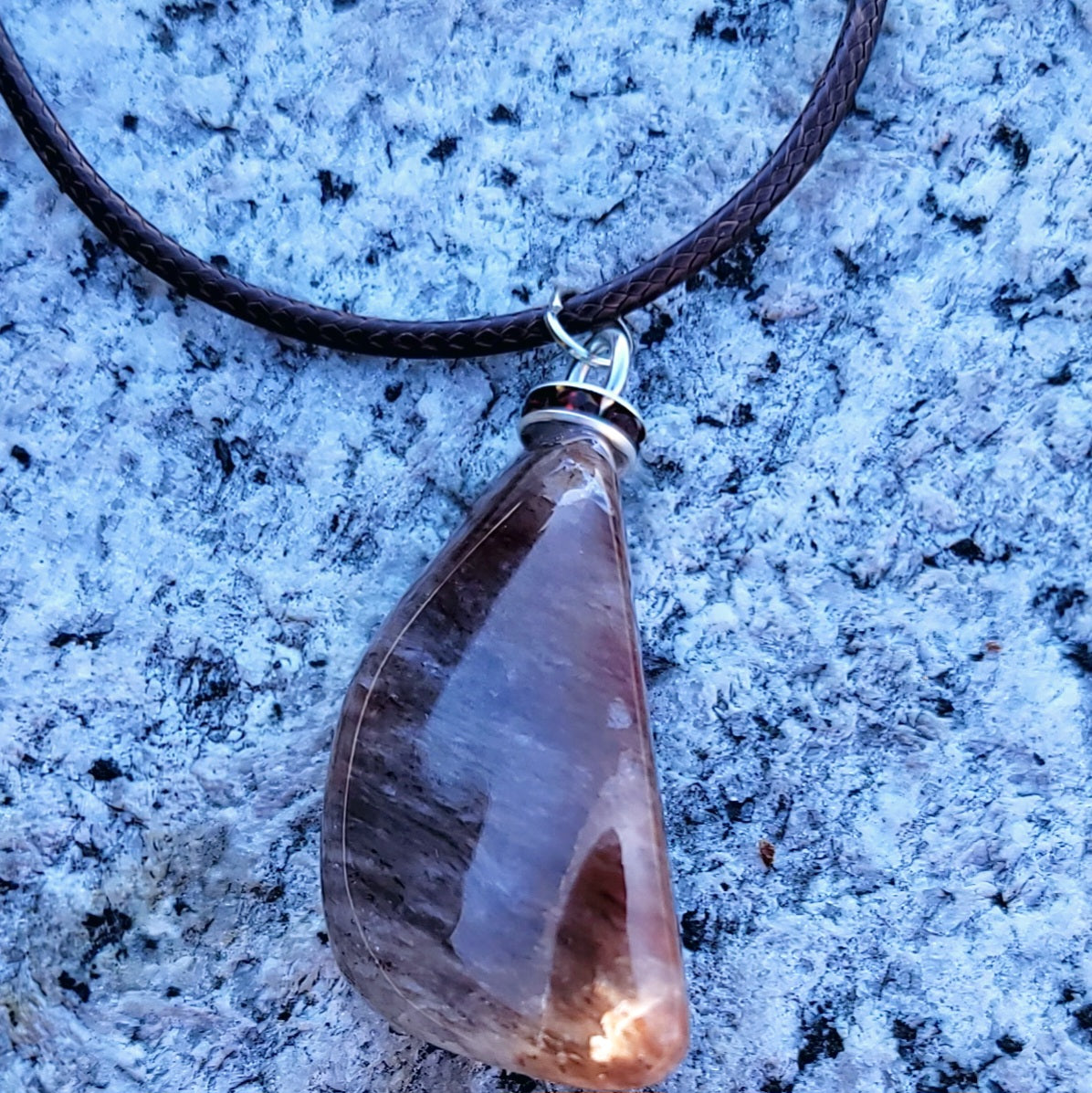 Intriguing Ferruginous Quartz Pendant. This unique piece will be a great gift for him or her this holiday season and beyond. Treat them today, or just treat yourself to it!