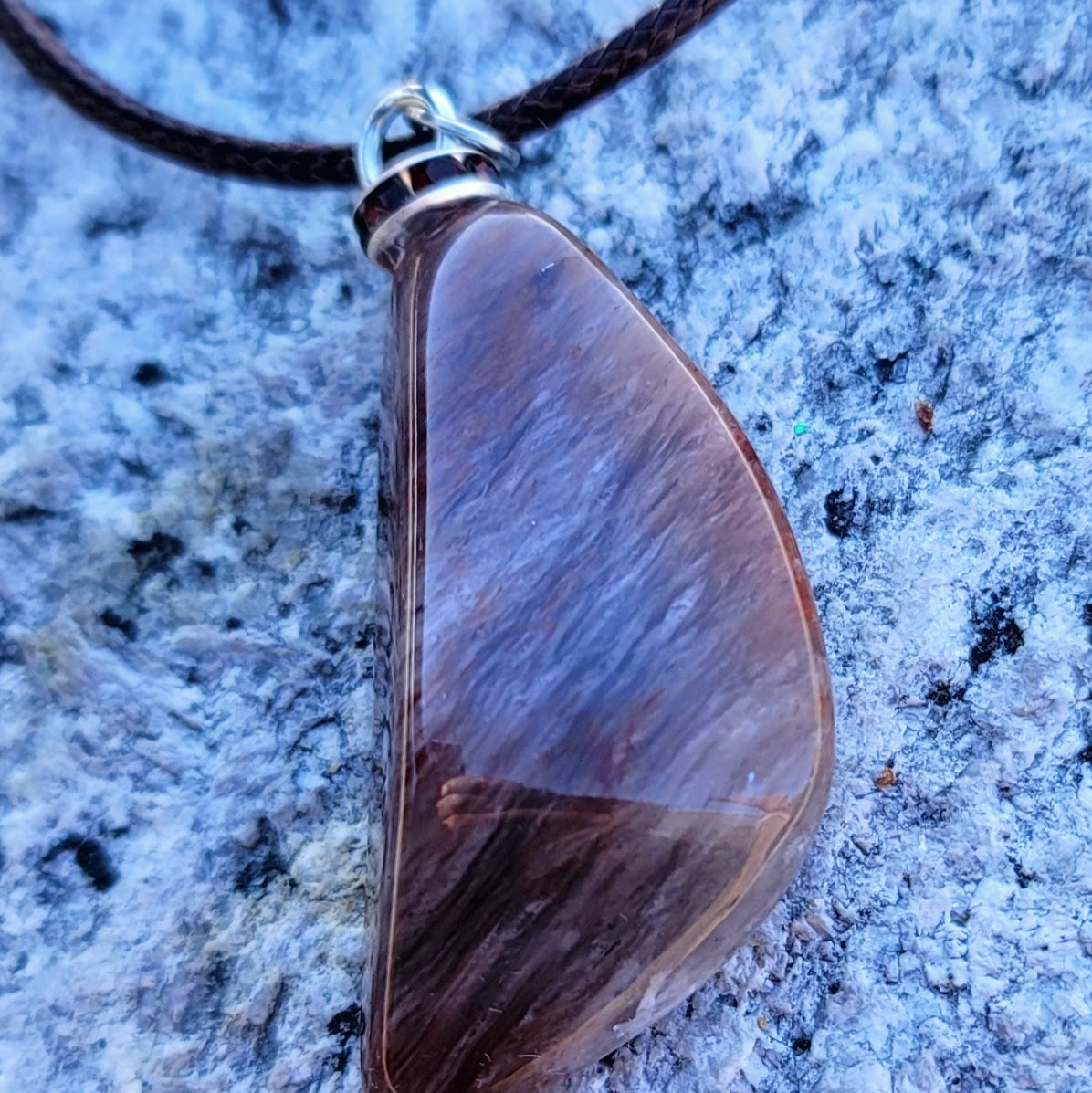 Intriguing Ferruginous Quartz Pendant. This unique piece will be a great gift for him or her this holiday season and beyond. Treat them today, or just treat yourself to it!