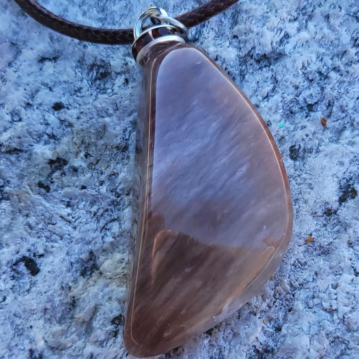 Intriguing Ferruginous Quartz Pendant. This unique piece will be a great gift for him or her this holiday season and beyond. Treat them today, or just treat yourself to it!